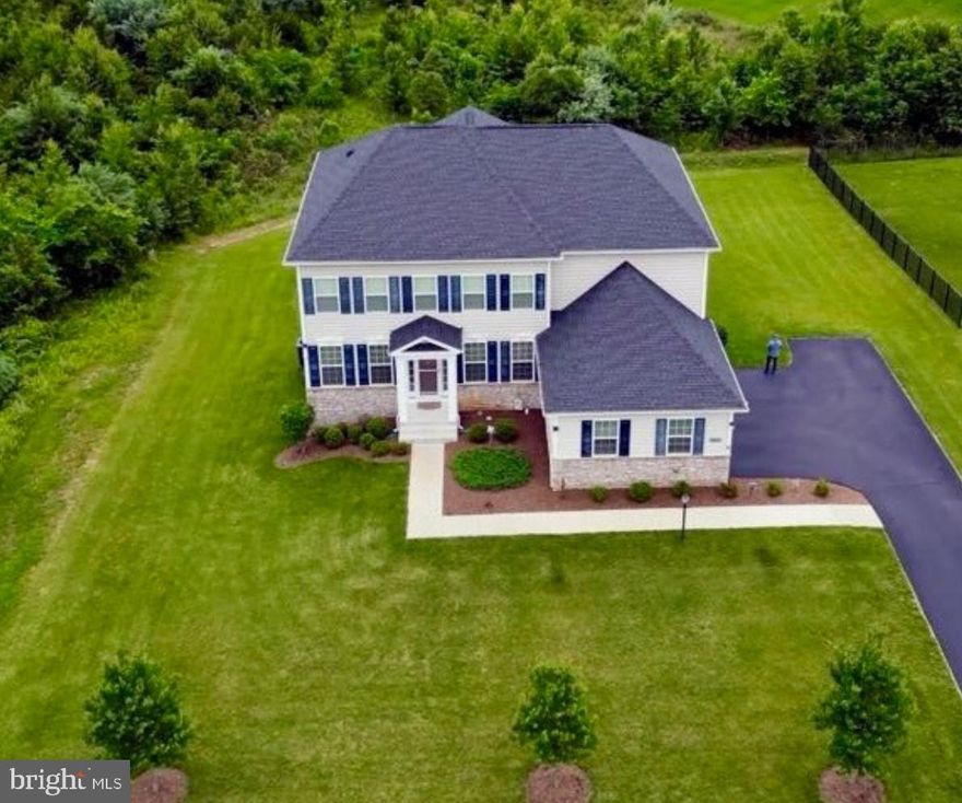 Meticulously maintained and thoughtfully designed, this stunning four-bedroom, three-and-a-half-bath residence with a three-car garage is nestled on a private, tree-lined 0.48-acre lot. From the bright, open-concept layout spanning three finished levels to the gourmet kitchen featuring an oversized island, soft-close cabinetry, and custom pantry shelving, pride of ownership is evident throughout.

Step out onto the screened-in porch that leads to a spacious patio complete with a built-in fire pit, perfect for both quiet evenings and lively gatherings. Upstairs, you will find generously sized bedrooms, including an elegant primary suite with a spa-inspired bathroom and custom-designed closets. An upper-level laundry room adds everyday convenience.

Accepting Back up Offers

The fully finished walk-out basement offers even more living space, complete with a stylish bar that includes a wine fridge, a full bathroom, and an additional bedroom ideal for guests, a home office, or multigenerational living.

Additional features include a 10 zone in-ground irrigation system, a 220-volt electric vehicle charging outlet, custom-built attached storage shed, and abundant storage space throughout the home.

Tucked away in a quiet, welcoming neighborhood known for its well-maintained common areas, low traffic, and relaxed homeowners association, this community offers both privacy and a strong sense of connection.

Enjoy the best of both worlds with a peaceful setting and quick access to major routes such as Route 7, Route 28, and the Dulles Greenway. The home is just minutes from Dulles International Airport, shopping, dining, and entertainment.

This is more than just a home; it is a true lifestyle upgrade. Do not miss the opportunity to enjoy luxury, convenience, and community, all in one exceptional location.