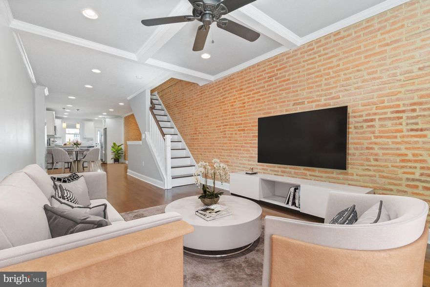 Federal Hill Living with Private Parking + Deck! Welcome to 1614 Clarkson Street — this stunning three-level Federal Hill townhome combines timeless finishes with modern functionality and coveted city conveniences. This beautifully updated 3-bed, 3-bath home sits on a quiet one-way street in the heart of Federal Hill and comes with rare perks: private parking and a private deck. Step inside and you’re greeted by an open, airy living space featuring a gorgeous coffered ceiling and seamless flow into the dining area and kitchen—perfect for hosting dinner parties or game-day hangs. The modern kitchen boasts stainless steel appliances, tons of storage, and plenty of prep space for your inner chef. Upstairs, the primary suite is your personal escape, complete with an ensuite bath and direct access to a private deck—ideal for morning coffee or evening wine. The second bedroom and full bath offer great flexibility for guests, a home office, or creative space. Bonus: laundry on the upper level means no hauling clothes up and down stairs. The fully finished lower level adds even more versatility with a third bedroom, full bath, and plenty of room for a media space, gym, or cozy hangout. Live steps away from everything you love about Federal Hill—top-rated restaurants, cafes, shops, and parks. You’re also close to the Inner Harbor, stadiums, and the Baltimore Peninsula, with easy highway access when you need to get out of town. With its unbeatable location, modern updates, and private parking, 1614 Clarkson Street is urban living done right. Motivated seller is including a 1-year home warranty for peace of mind.