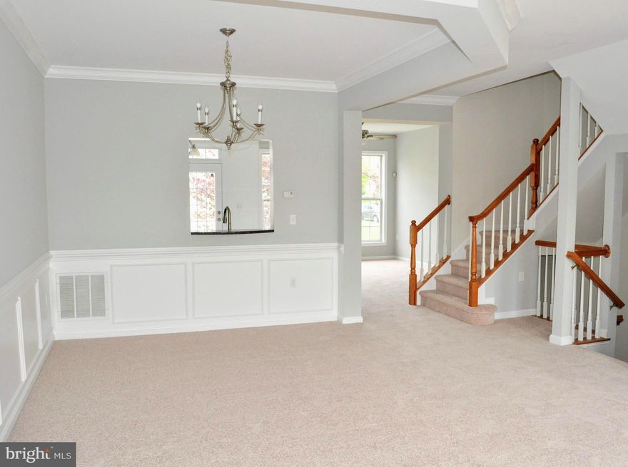 Beautiful three-level  townhouse with three bedrooms, two full baths and two half baths, with a fireplace next to the newly renovated kitchen. This home has recently been renovated with new carpets, fresh paint, granite countertops, and stainless steel appliances. The two car garage is attached to the finished basement. This home is ready to move-in!