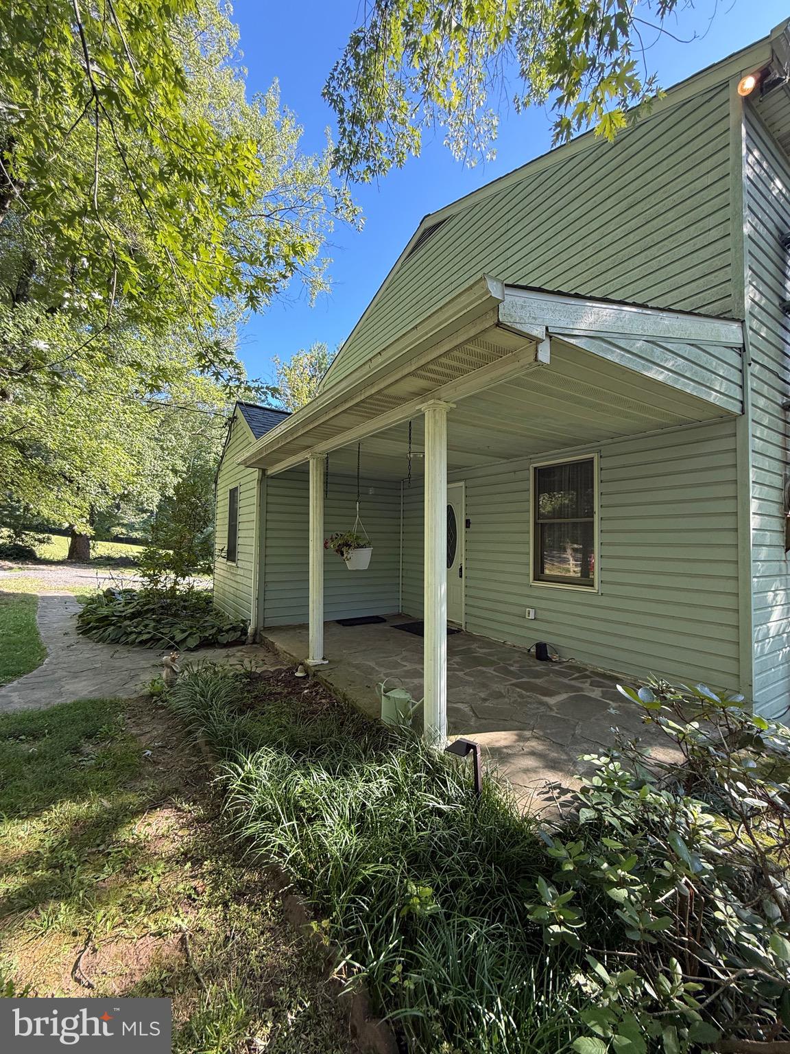 MORE MOTIVATIONAL LIST PRICE! Fantastic price with loads of potential…and NO HOA dues! This 1.01 acre lot in desirable Marriottsville just 2 miles off I-70 is the best of both worlds. A charmed three-level country style farmhouse within easy reach of convenient commuter transportation. Delight in the spacious rooms throughout the entire home, including five (5) bedrooms -- one main level bedroom can be used as den or office. Both main & upper-level full baths offer walk-in showers, but the main level one also has a separate tub/shower. The entry level living room has a warm wood-burning stove that provides ample and heart-warming compliment to the HVAC system during cooler months. The folksy country kitchen and adjacent large family room give separate access to the 28’ x 14’ rear deck with panoramic views of the flat, wooded lot (with redeemable & frog-friendly Koi Fish pond). There is an off-road gravel driveway that can accommodate up to nine (9) cars, with a super-sized drive-in shed at its end. The full basement has plenty of storage and all work areas/items/tools, which convey, will likely suit the fancy of the handyperson or tinkering type. The roof was recently replaced (approximately 2 years ago) and the 50-gallon water heater is 4 years old. Also COMPLIMENTARY RING Video Doorbell at front door conveys! The list price accounts for some TLC still need, such as replacement carpeting/flooring, paint, and some kitchen and/or enhancements. Make it your own, but don’t delay! Lots this size ... in this location ... with such potential, won’t stay long on the market … at this price!