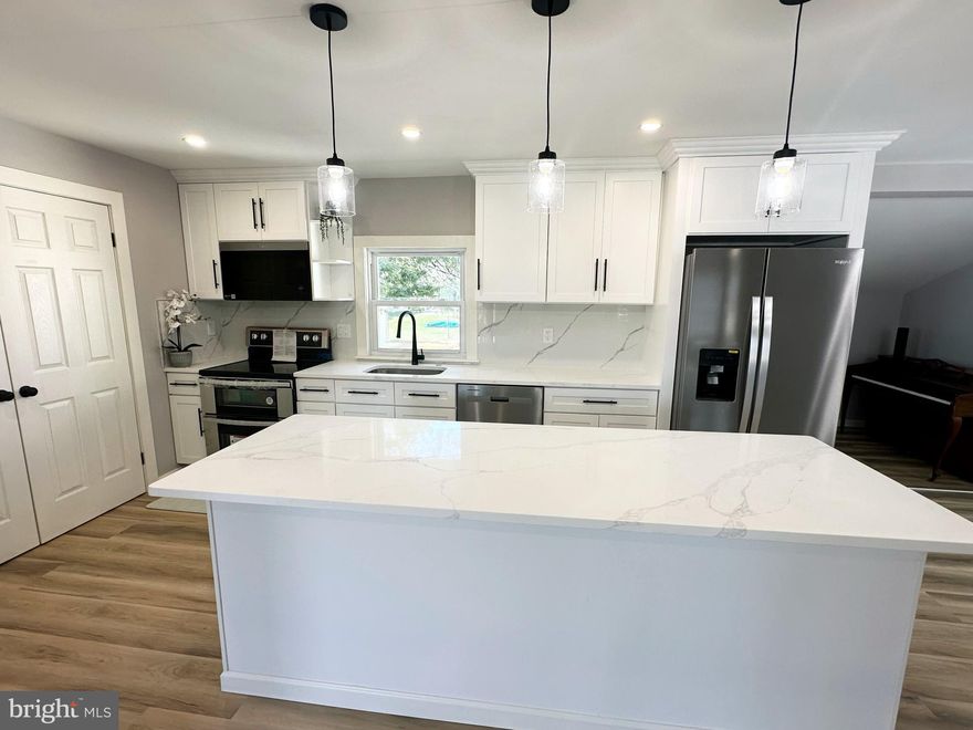 Discover your dream home in the desirable Pennsbury School District!  Step in this beautifully newly updated 3-bedroom you will find an oversized, open-concept kitchen that is the true centerpiece of the home.  Designed with both style and functionality in mind, it features white cabinets, granite countertops, stainless steel appliances, and a large island with seating—perfect for casual dining and entertaining. The entire home is adorned with brand-new luxury vinyl plank flooring, combining modern aesthetics with durability. The layout is designed for both comfort and versatility, starting with the formal living room that overlooks the side yard and opens to a patio and fenced backyard. Adjacent is the formal dining room, seamlessly flowing into a spacious family room that offers endless possibilities for relaxation or hosting guests. The remodeled bathroom exudes elegance with a full tub and marble tile detailing in the shower. This home offers new high-efficiency gas heat and central air to ensure year-round comfort.   This home is move-in ready and don't miss this gem!