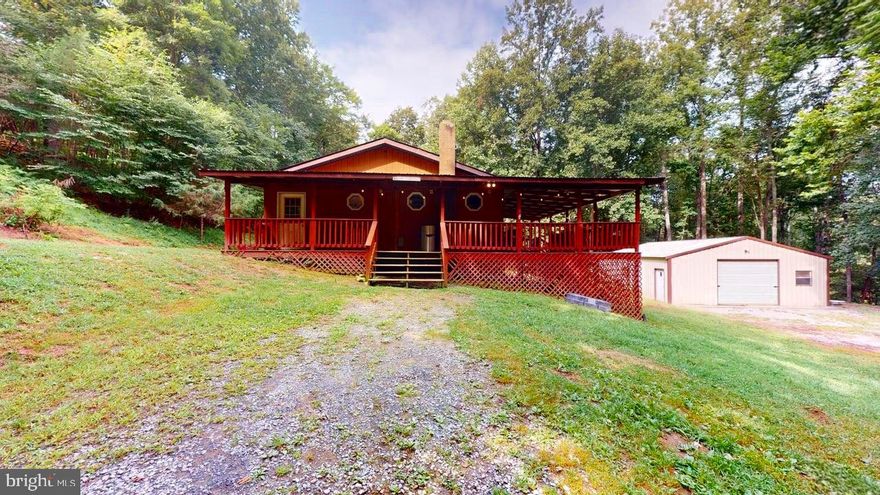 Situated at the end of the road, surrounded by wooded nature and behind a gate in the Hills of WV sets this 3 bedroom 2 bath home with a 30'X27' garage/workshop.  As you come through the gate the wrap around porch will welcome you to want to see more.  Just minutes outside the small town of Capon Bridge and only about 30 minutes from Winchester Va makes this a great location to commute to work yet enjoy the advantages of WV living.  Capon Bridge Resort offers private access to the Cacapon River, Edwards Run Wildlife Management area which consist of 500 acres of public Hunting and a 3 acre stocked Lake provides fishing and swimming.  Come check out this secluded home and make it your own.  


A whole lot of new has been added.  Paint, flooring & more.