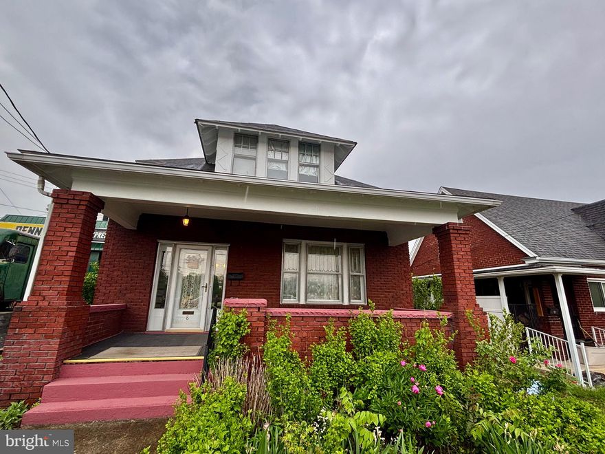 This charming home offers a spacious floor plan on the main level, featuring a welcoming foyer, formal dining room and a bright living room with beautiful natural hardwood floors throughout. The kitchen features an eat-in dining area, perfect for everyday meals or entertaining, along with a convenient half bath on the main level.
Upstairs, you’ll find three bedrooms with hardwood floors, generously sized closets, and a full bathroom. The basement offers laundry space and additional storage potential.
Outside, enjoy both front and back porches, a fenced backyard and a detached carport located at the rear of the property.  Conveniently situated near UPMC, just minutes from I-68 and downtown Cumberland, this home combines charm, character, and convenience with so much to offer.  Schedule your showing today!