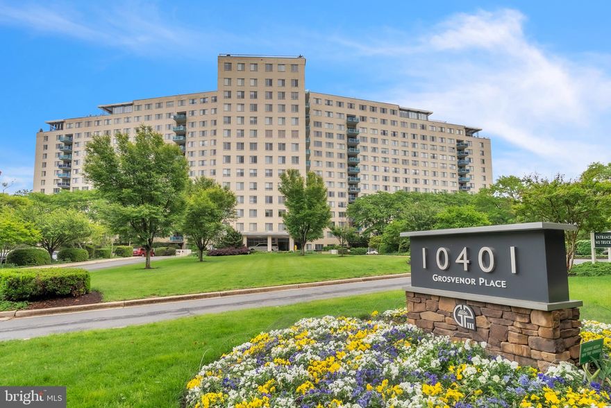 Welcome to Unit #410 at Grosvenor Park, a bright and spacious corner unit offering 2 bedrooms and 2 bathrooms with abundant natural sunlight throughout. The updated kitchen features granite countertops and stainless-steel appliances, while brand new carpet adds comfort to both bedrooms. The expansive living and dining area opens to a private balcony, creating the perfect space for relaxing or entertaining. Ample closet space throughout the home provides excellent storage. Two prime garage parking spaces convey, including one conveniently located next to the building entrance.
Residents enjoy an array of onsite amenities including laundry facilities, clubhouse, fitness center, swimming pool, tennis courts, green space, 24/7 front desk/security, dry cleaners, and Grosvenor Market for beer/wine & groceries.  A short walk to Grosvenor–Strathmore Metro Station and ideally located just minutes from, I-495, I-270, National Institutes of Health, Walter Reed National Military Medical Center, plus shopping, dining, and entertainment at Pike & Rose, Whole Foods Market, Strathmore. Music Hall, and so much more.