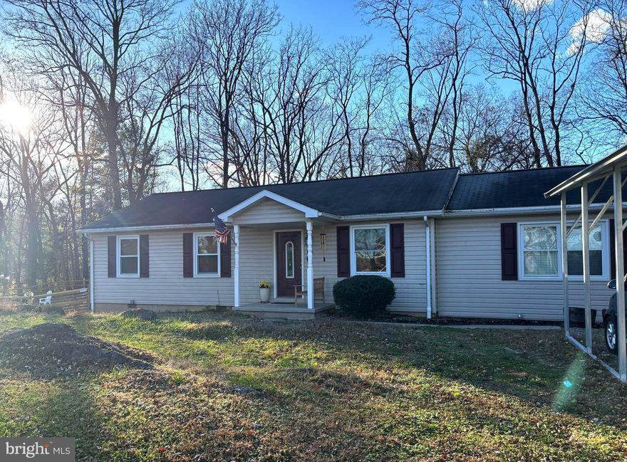 Welcome to 136 Woodcock Ave — a spacious 3-bedroom, 1.5-bath rancher set on nearly half an acre in the established Mecklenburg Heights community. Offering comfortable one-level living and a wide, gently wooded lot, this home blends everyday ease with the quiet charm of a well-loved neighborhood just minutes from historic Shepherdstown.

Step inside to a bright living room that sets a warm, welcoming tone and leads naturally into the updated kitchen. Modern finishes, ample counter space, and an efficient layout make cooking and daily routines feel effortless. Low-maintenance flooring extends throughout, and the adjoining mud/laundry room adds convenience right off the kitchen.

* Professional Photos will be added shortly *

The bedroom wing features 3 comfortable rooms with easy access to a full bath plus an additional half bath, creating a practical layout that works well for residents and guests. Soft natural light brightens each space, giving the home a relaxed and inviting feel throughout.

Out back, a large deck overlooks the tree-lined edge of the property — perfect for morning coffee, evening dinners outdoors, or quiet moments at home. Recent improvements including newer siding, windows, roof, and HVAC offer added peace of mind and long-term value.

Residents of Mecklenburg Heights enjoy the benefits of an established community with modest HOA dues and well-maintained surroundings. The location places you just minutes from Shepherdstown’s locally loved cafés, boutiques, and seasonal events, as well as Shepherd University and scenic walking paths along the Potomac River. Commuters will appreciate easy access to Martinsburg, Harpers Ferry, Route 45, and major travel corridors throughout the Eastern Panhandle.

With thoughtful updates, effortless one-level living, and a setting that blends convenience with small-town charm, this property is an exceptional opportunity in a sought-after Shepherdstown community.