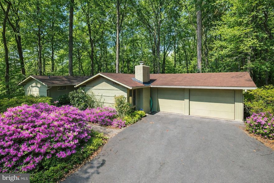 Discover 9508 Michaels Court, a unique mid-century modern home in the sought-after Tusculum community of Bethesda. Tucked at the end of a cul-de-sac, this property sits on 0.60 acres surrounded by mature landscaping and backs to woods adjacent to Georgetown Swim Club property—offering no future development and exceptional privacy. The home provides 3,008 total square feet over two levels, with 4 bedrooms and 3 full bathrooms.
 Notable updates and features include a roof replacement with weather seal (approx. 2011), dual-zone HVAC with A/C replaced in 2025 and 2023 and heat replaced in 2024 and 2006, new hot water heater (2016), new thermal expansion tank (2023), all original windows replaced with high-end Andersen windows, LED recessed lighting added, hardwood floors throughout the main level, skylight, and updated bathrooms. Lovingly maintained by the current owners, the home’s systems have been serviced by a single company since 1998, and an arborist regularly visits the property for tree care and landscaping upkeep.
 True to its mid-century modern design, the home showcases a cohesive blend of materials and dramatic walls of floor-to-ceiling windows that frame the serene setting and capture southern exposure for beautiful afternoon sun. The current owners added an expansive rear deck with a stone walkway to the driveway and rear garage access. The garage, converted from a carport, also includes a potting shed and storage space for garden equipment and built-in shelves.
 A paver patio, bird bath, and mature azalea bushes create a warm welcome to the home. Inside, the entry foyer is finished with slate tile flooring and opens to a stunning living space highlighted by a wall of windows, cathedral ceiling, and hardwood floors. The deck is accessible through French doors from the living room, dining room, and primary bedroom. The kitchen features a skylight, solid wood cabinetry, a pass-through to the dining room, a center island with breakfast bar, and Silestone countertops. It contains a spacious sitting room with a gas fireplace, a brick accent wall, and space for a breakfast table.
 Privately situated on the opposite side of the main level, the primary suite offers a walk-in closet, second closet, ceiling fan, and a glass door opening to the deck. The en-suite bathroom includes a glass-door shower and contemporary tile and finishes, and garden window. Two additional bedrooms and a hall bath complete the main level.
 The walk-up lower level includes a family room with a cozy wood-burning stove. An additional bedroom and full bathroom are located on this level, along with a laundry room featuring cabinetry, a utility sink, and a side exit door. The utility room has abundant storage space and the floor to ceiling shelves convey.
 Ideally located with easy access to dining, shopping, entertainment, and major commuter routes, as well as nearby parks, recreation, and nationally rated golf courses, this home is also served by top-rated public and private schools. Don’t miss this exceptional opportunity to own in one of the DC area’s most sought-after communities.