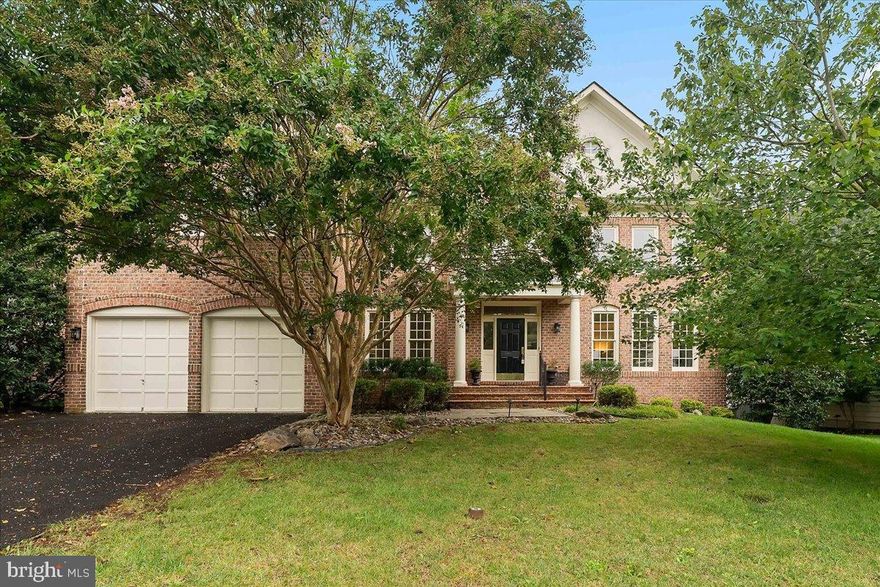 Discover an exquisite blend of elegance and comfort in this stunning Colonial residence, nestled within a prestigious gated community. Spanning over 4,156 square feet, this home boasts five spacious bedrooms and four and a half luxurious bathrooms, designed for both relaxation and entertaining. Step inside to find a grand foyer adorned with crown moldings and rich wood floors, leading to an open floor plan that seamlessly connects the gourmet kitchen and light filled two story family room. The kitchen is a culinary masterpiece, featuring upgraded countertops, a large island, and top-of-the-line stainless steel appliances, including a double oven and gas cooktop, lots of recessed lights and under cabinet lights. A butler's pantry enhances functionality, while the breakfast area invites casual dining. Retreat to the opulent primary suite, complete with a walk-in closet and a spa-like bathroom featuring a soaking tub and stall shower with dual shower heads. This home includes built in speakers, for whole house audio, located in the family room, lower level recreation room, primary bedroom and bathroom.  The fully finished basement offers additional living space, a legal bedroom and full bathroom, additional washer and dryer connections, a theater room that is already wired with surround sound and speakers (the only things you need are the projector and screen), complete with a walkout entrance, perfect for hosting gatherings or enjoying quiet evenings by the fireplace. Outside, the property is beautifully landscaped, with night lighting, backing to serene wooded views that provide a tranquil backdrop. Enjoy outdoor living on the expansive Trex deck or patio, ideal for entertaining or unwinding in nature. Both the UL deck and the LL patio have gas connections for the grill!  The 2 car garage is oversized and include a professional grade safe, while still allowing room for the cars.  The community amenities include a sparkling pool, tennis courts, and a fitness center, ensuring a lifestyle of leisure and luxury. With an attached garage and ample parking, this home is a true sanctuary, offering an unparalleled living experience in a coveted location. Embrace the exclusive lifestyle that awaits you in this remarkable property.  Recent updates:  ROOF 2021; H20 HEATER 2024; UL HVAC 2021; LL HVAC COMPRESSOR 2024