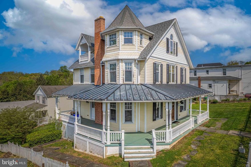 Completely one of a kind dream home situated in the heart of Brunswick, this stunning Victorian residence boasts spectacular panoramic views of the Potomac river, Virginia, and West Virginia from its private upper balcony. Enjoy the definition of tranquility with picturesque sunsets from treetop level and the full wraparound porch, making this home truly unique and perfect for those seeking a peaceful retreat.

This grand and meticulously restored home has been fully redone top to bottom while preserving its original charm and character. Soaring high ceilings, gleaming wood floors, and crown molding throughout add to its timeless elegance. The large quarter acre property sits on 3 city lots, fully fenced for privacy and security.
The grand dining and living rooms are perfect for entertaining family and friends, with a sweeping staircase leading up to 3 levels. The gourmet kitchen has been completely redone with beautiful white cabinetry, adding a modern touch to this historic home.

The beautiful master suite and massive private master bath provide the perfect retreat after a long day. Other recent updates to the home include a new roof, HVAC system, and hot water heater, all just 3 years old.

Located only 8 miles from historic Harpers Ferry and with convenient access to R-340, R-15, Frederick, Charles Town, and Leesburg, this home is perfect for those seeking an easy commute. The MARC train station is accessible within minutes, adding to the convenience of this location.

Truly a must-see, this home's interior was completely rebuilt to the highest standards, making it the perfect combination of historic charm and modern luxury. Don't miss out on the opportunity to own this stunning Victorian home in the heart of Brunswick!