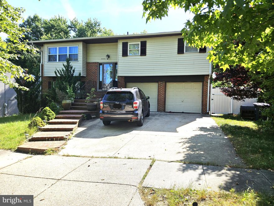 Fabulous opportunity for single family home with 2 car garage at the end of a no thru street on the most private lot surrounded by trees.  Updated kitchen with granite counters and stainless steel appliances. Wood floors throughout main level. Separate dining room and living room upstairs with 3 bedrooms. Lower level offers 2 extra bedrooms and the two car garage.  Fully fenced rear yard. Convenient to 495, Suitland Pkwy, Branch Ave, Pennsylvania Ave, so many major arteries to get onto.  Great priced so act fast!