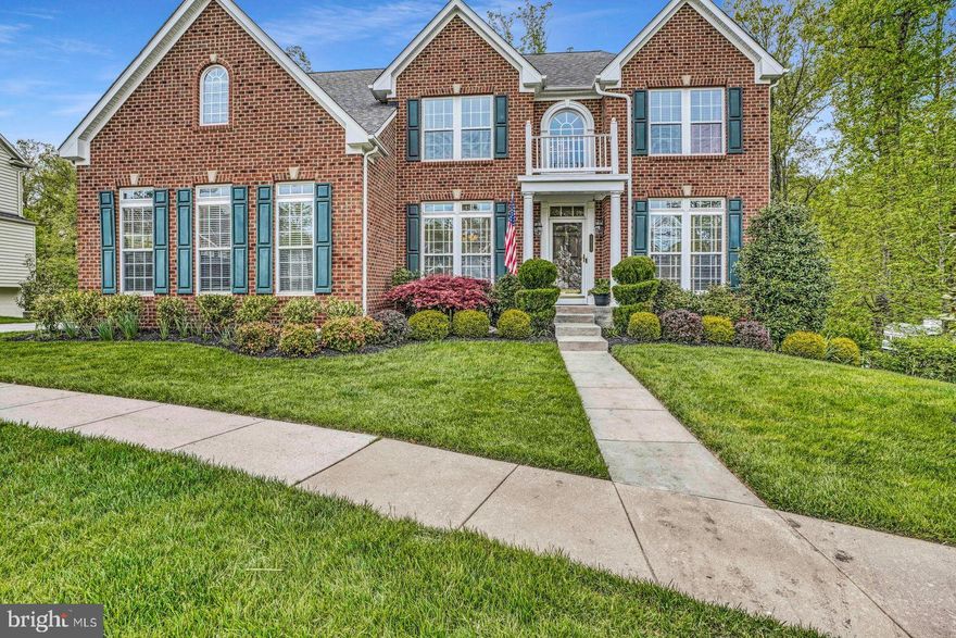 Elegance  in The Enclave at Perry Hall!  This stately brick-front home is nestled on a quiet cul-de-sac and backs to Gunpowder Falls State Park.  A dramatic 2-story foyer greets you as you enter the home with formal dining and living rooms on either side.  Continue into the sun-drenched family room with gas-burning fireplace and proceed just steps further into the gourmet kitchen and breakfast room.  Kitchen highlights include a large island, double wall oven, SS appliances and granite counters with tile backsplash.  The Breakfast Room has additional counterspace and cabinetry and has a door that walks out to the 14’ x 29’ composite deck with stairs leading down to the rear yard.  A half bath, optional 5th bedroom and access to the garage round out the main level.  Upstairs, you’ll be swept away by the Primary Suite, offering gobs of space, 2 Walk-In Closets and luxurious bathroom appointments.   An upper level laundry room sits just outside the Primary along with a full hall bath and 3 additional spacious bedrooms.  Stroll down to the basement and you will be blown away by the amount of space.  The rec room boasts a second gas-burning fireplace with impressive stone hearth and surround.   Also in the basement, there is a separate media room, a hobby room / office space and full bath.  It gets better,  walk out of the basement onto the extraordinary hardscaped patio (nearly 900 sq ft) with built in fire pit.  Unwind and relax in the private and tranquil setting this backyard provides, while you enjoy gazing into the park!  A brand new, oversized shed conveys with property.  A side-entry two car garage and over-sized driveway allows for plenty of off street parking.  Location, privacy, impressive finishes and smart technology are all reasons you should schedule your showing!