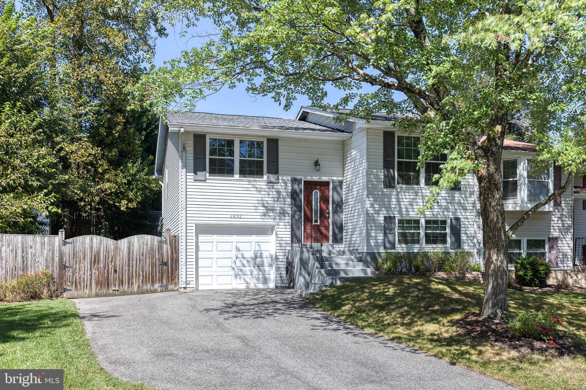 Welcome to April Dawn Way – A Beautifully Updated Semi-Detached Gem in Sought-After Four Seasons Estates! This meticulously maintained semi-detached home offers the perfect blend of comfort, style, and location, plus a brand new roof and thermostat! With easy access to major commuter routes including MD-97, MD-100, and MD-32, and just minutes from Fort Meade, NSA, and Northrop Grumman, this home is ideal for professionals, families, and commuters alike. Pull into your private 3-car driveway and step into your new home. While the garage has been converted for added interior living space and no longer fits a vehicle, it offers valuable square footage that enhances the home’s functionality and versatility. As you enter, you're welcomed by an expansive, light-filled living room with oversized windows and an open layout that provides flexibility for a variety of furniture arrangements. The space flows effortlessly into the kitchen and dining area, creating a warm, inviting environment perfect for everyday living or entertaining. The kitchen features sleek recessed lighting, stylish luxury flooring that’s both trendy and durable , ample cabinet storage plus a separate pantry closet, and plenty of counter space for prepping meals and hosting. The dining area is large enough to accommodate a full-sized table for family dinners, holidays, or casual brunches with friends. There are two generously sized bedrooms are located on the main level, each offering large windows for natural light, spacious closets, and neutral paint tones for a move-in ready feel. These bedrooms share a beautifully renovated full bathroom, featuring: custom tilework, modern fixtures, with a clean, spa-like ambiance. Enjoy a lower level retreat! Discover an incredibly versatile recreation room—perfect as a man cave, she-shed, playroom, media center, or even a home office. The space is limited only by your imagination. Also on this level: A third private bedroom, ideal for guests or multigenerational living with a luxurious full bathroom with upgraded finishes plus a massive laundry/storage room that offers incredible organization potential—plenty of space for bikes, seasonal items, tools, or even a workout area. Step outside to a fully fenced backyard, ideal for pets, play, and entertaining. Fire up the grill and get ready for unforgettable summer BBQs, cozy fall fire pits, or tranquil mornings with a cup of coffee on the patio. This home truly has it all—space, style, and location—all wrapped into one beautiful package.
