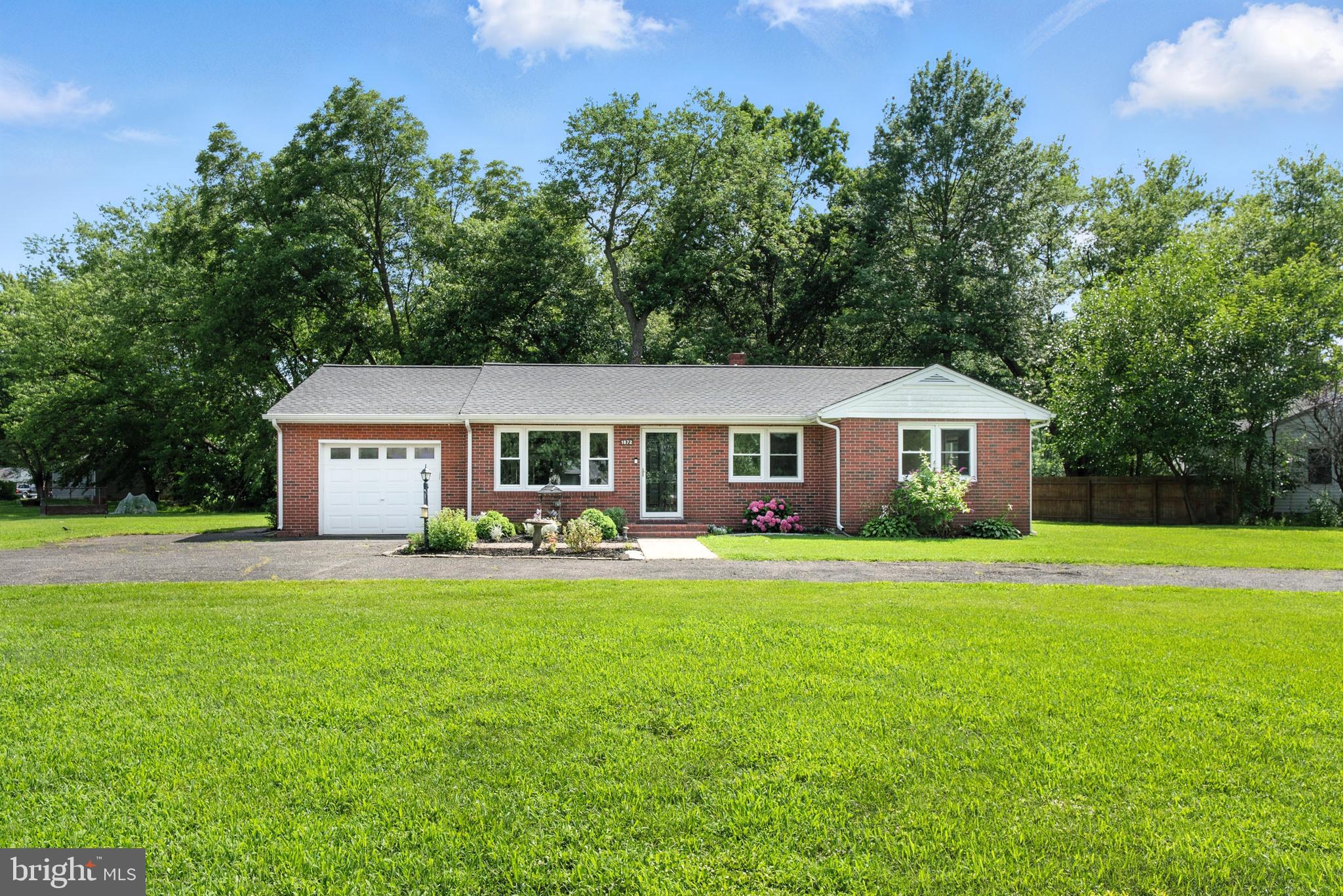 1872 Harbor Drive, Chester, MD in the Sought-After Harbor View Community
Premium Corner Lot | Nearly ¾ Acre | Renovated Brick Rancher
Located in the established Harbor View neighborhood, this fully renovated brick rancher sits on a rare, oversized corner lot—nearly three-quarters of an acre made up of two parcels. The expanded lot offers flexibility for future additions, such as an in-ground pool, a detached garage, or an oversized pole barn.
The home’s layout was designed with both everyday living and entertaining in mind. The kitchen has been fully updated with sleek countertops, stainless steel appliances, and refreshed cabinetry. A functional layout provides generous prep space, making it easy to cook and host at the same time.
Adjacent to the kitchen is the open-concept great room, centered around a newly installed wood stove. The space is bright and inviting, with plenty of room for gatherings, whether that’s movie nights, family celebrations, or quiet evenings at home.
The home features three well-sized bedrooms and two fully renovated bathrooms. Each bathroom includes updated tile, vanities, and fixtures. Other major updates include a newer roof, windows, recessed lighting, interior paint, new flooring, and a new hot water heater. A reverse osmosis system, water softener, and newer well tank have also been installed.
Outside, the large lot offers plenty of usable yard space—ideal for pets, gardening, or outdoor dining. A circular driveway and attached garage provide easy parking and storage.
Harbor View is located on Cox Creek and Cox Neck Road, just two miles east of the Chesapeake Bay Bridge. Residents enjoy access to five miles of walkable neighborhood roads, a community field, playground, and pavilion. Just minutes from the Kent Narrows, the Cross Island Trail, and the Queenstown Outlets, this location offers both convenience and a strong sense of community. Schedule your showing today!