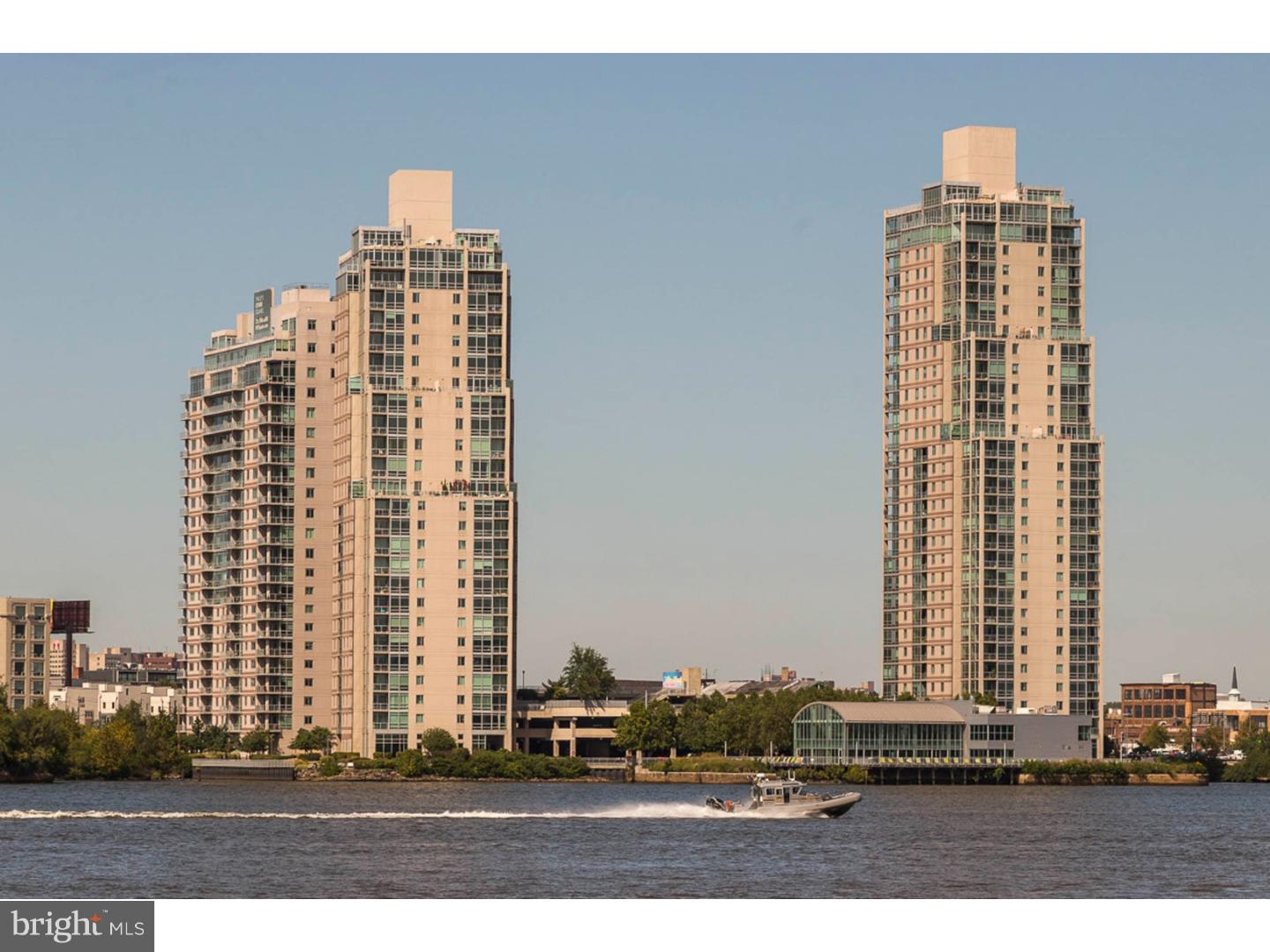 Gorgeous Waterfront Square One Bedroom plus den with unobstructed Ben Franklin Bridge Views and Skyline Views of Center City Philadelphia. This large One Bedroom plus den offers soaring 10ft Ceilings with Floor to Ceiling Windows in Living Area and Den.With Double French Doors leading into Den which could also be used as a Second Bedroom.This condominium offers gorgeous Hardwood Flooring in Living Area, Upgraded Kitchen with a GE Monogram Range Hood,Stainless Steel Appliances, Granite Counter tops,Marble Bathrooms with a Jacuzzi tub in Master Bathroom,Master Bedroom has a Walk In Closet. Waterfront Square offers Resort Style amenities including: Lap Pool, State of the Art Fitness Center,Spa, River Deck,Shuttle Service to Center City,24hr Concierge/Valet,Gated Community,all this plus a Convenience Store for your Late Night Snacks. One Parking License Included. Storage Locker on 22nd floor also included. This one is a gem! New carpet in Bedroom just installed.