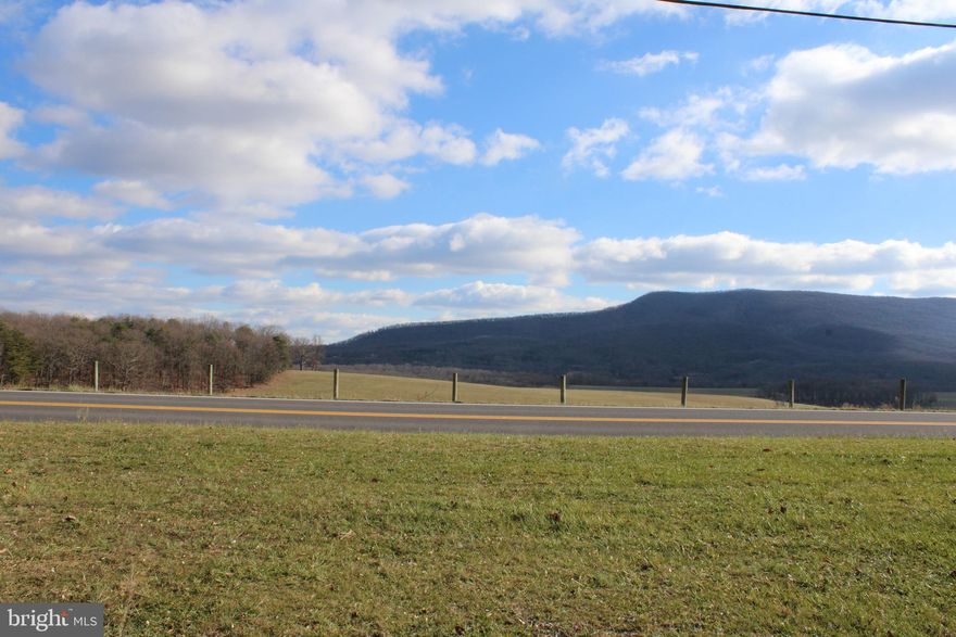 Experience the best of Augusta, WV, with this extraordinary 5-acre property that perfectly blends natural beauty, modern convenience, and endless potential. Ideally located with direct frontage on Ford Hill Road, this unrestricted parcel is a rare find, offering stunning views of Short Mountain and a peaceful, private setting surrounded by towering hardwood timber. Ready to bring your vision to life, the property features easy access to electricity and the unique benefit of two public water taps, providing exceptional value and flexibility for future development. Whether you dream of building your forever home, creating a private retreat, or making a smart investment, this land offers the perfect foundation. Conveniently situated just minutes from US Route 50 and within an easy 40-minute drive to Winchester, VA, this property strikes the perfect balance between seclusion and accessibility. Opportunities like this are rare—don’t miss your chance to own a piece of Hampshire County’s unmatched beauty before it’s gone!