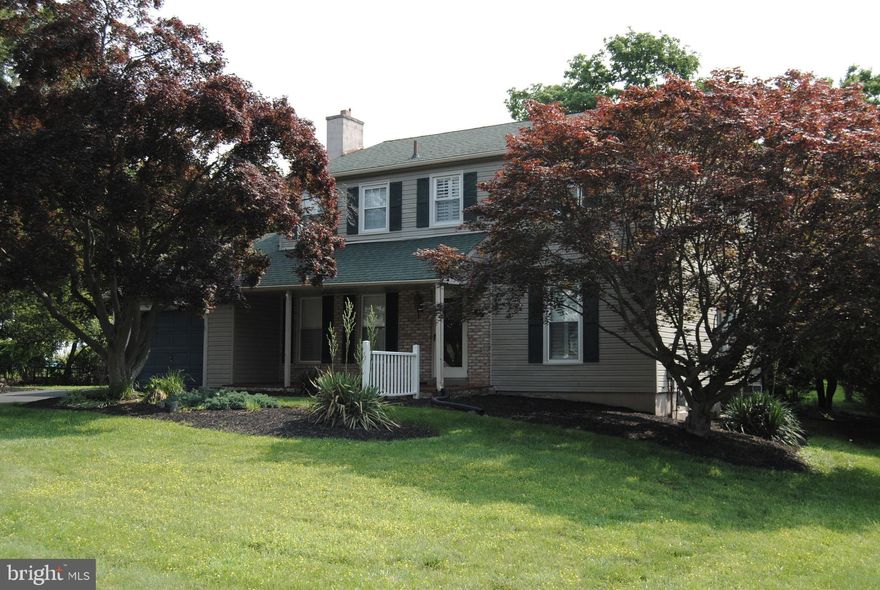 Lovely two story colonial in a highly desirable neighborhood located in the Neshaminy School
District. Excellent curb appeal featuring a covered brick front porch. You will enter into the center
hall foyer where you will find an open and flowing layout. Off the foyer is a spacious formal living
room with hardwood floors and a beautiful wood-burning fireplace. Across the hall, you will find
a formal dining room which leads into the kitchen, allowing for a natural flow for entertaining.
The kitchen has stainless steel appliances, laminate hardwood floors, recessed lighting, and a
nice island with seating. A large window brings in the natural light. In the back of the house,
there is a large family room that has a big bay window. Off the family room, you will find a
powder room, shower and laundry room with a washer and dryer. The second floor features four
spacious bedrooms with hardwood floors, nice sized closets and large windows. The primary
bedroom has a bathroom with a glass shower. There is a second full bath in the
hallway with a linen closet. Outside of the home you will enjoy a well-maintained backyard with
a covered patio. A one car garage offers access from the front and back with additional  driveway parking. 
Includes a full unfinished basement with lots of potential.   Beautiful louvered  shutters are found on most windows throughout the house. They add a touch of classic style and privacy. This home has been
lovingly cared for inside and out!