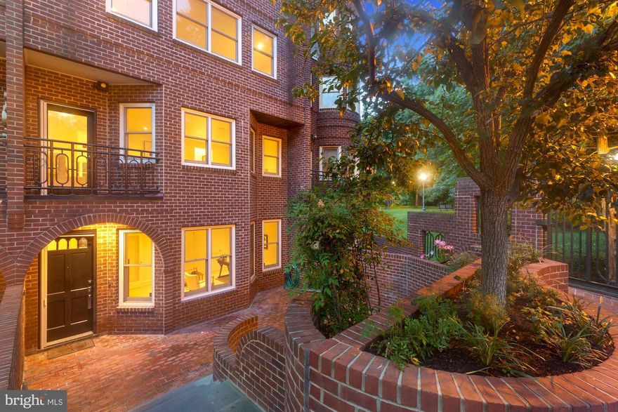 Welcome to 1215 28th Street NW! This beautifully renovated Georgian townhome offers modern, top-of-the line luxury in the heart of Georgetown boasting four Bedrooms with en-suite Baths, two Powder Rooms on the first two levels, and two car garage parking. Featuring exquisite millwork, Baldwin Hardware, and Porcelanosa Kitchen, Butler’s Pantry, and Bathrooms, this residence gleams at every inch. The first level consists of French Oak Herringbone hardwood floors spanning throughout the expansive Recreation Room with a Wet Bar, stone Fireplace, abundant built-in space, and access to the spacious Rear Patio. The first level also includes a light-filled Bedroom with en-suite Bath, Powder Room, Walk-In Closet, and access to the four-floor Elevator. A walk-up staircase brings you to the upper three levels of this stunning residence. The second level also features French Oak Herringbone hardwood floors throughout the airy Living Room with access to the Balcony, Porcelanosa Kitchen and Butler’s Pantry, Dining Room and Powder Room. The Kitchen boasts a statement marble island, light wood finishes, integrated appliances, double-wall oven, and generous counter and cabinet space. Adjacent to the Kitchen is the Dining Room, ideal for entertaining. The Primary Bedroom suite is located on the third floor, featuring a stunning en-suite Bath with grey stone countertops and tiling, dual-sink vanity, walk-in shower, and free-standing soaking tub. The Primary Bedroom suite also includes a Walk-In Closet, twin built-in wardrobes flanking the stone Fireplace, and another additional closet area. Adjacent to the Primary Bedroom is an additional light-filled Bedroom that features an en-suite Bath with marble-tiled walk-in shower and double closets. French Oak hardwood floors span throughout the third level in both Bedrooms as well as the Laundry area. The fourth level of this home also boasts French Oak hardwood floors throughout the fourth Bedroom, which includes an en-suite Bath, abundant closet space, and lunette window. The spacious Roof Deck is accessible through the fourth level and provides a more secluded outdoor area for entertaining or relaxing in the sunshine. In addition to the Elevator, this home includes a number of updated features to add ease to everyday life: brand new WIFI-programmable HVAC system with Aria Vents, WIFI boosters on each floor, in-ceiling Klipsch Bluetooth speakers in each room, Lutron Switches, Ring Video Doorbell, waterproof grey granite rock speaker on the Rear Patio, and outdoor speakers on the Roof Deck. This residence is in a Homeowners Association that offers maintenance and security amenities covered by the monthly fee of $991. Underground garage parking for this home includes two assigned spaces. In close proximity to historic homes, shops, and restaurants, this home is ideal for anyone looking to find luxury, modern living in Georgetown.