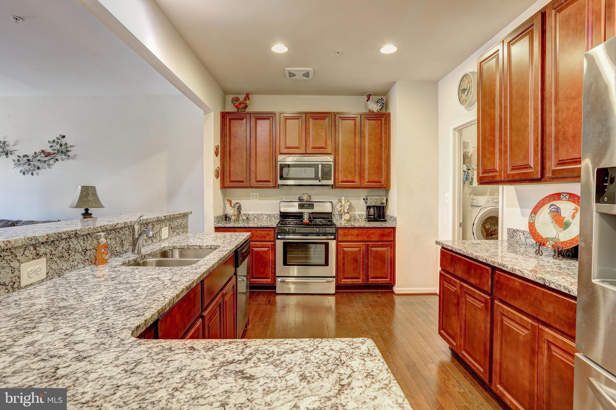 Spacious open floor plan in this 55+ Community home. Beautiful kitchen offering stainless steel appliances, granite counters, maple cabinets, large food pantry and counter top seating, living room with gas fireplace and sliding glass door to fenced in paver patio, separate dining room, half bath, and 2 car garage. Main level master bedroom w/ french doors, master bath has double sink and walk-in closet. Upstairs offers 2nd bedroom, loft as possible 3rd bedroom, full bath and another additional room/office/study/storage. Home has fire suppression system, air purifier system and odor suppression system. Community features: Walking trail & community center. Very close to entertainment & dining w/ easy access to major roads. It's time to enjoy easy living!