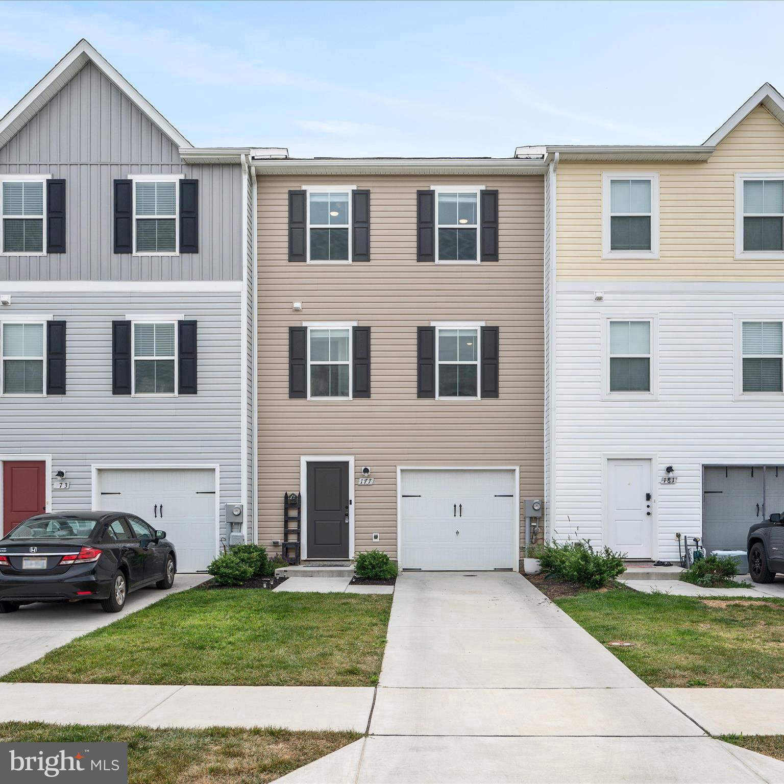 Welcome to 177 Perdiz Road, a beautifully maintained interior-unit townhome in the highly sought-after Dillon Farm community. Spanning three levels, this home offers a spacious open-concept layout that blends comfort with style. The kitchen is both functional and welcoming, featuring stainless steel appliances, granite countertops, a coffee bar area, and added cabinetry for plenty of extra storage. It flows seamlessly into the living room area, creating a warm and inviting space perfect for family gatherings and entertaining friends.
Upstairs, the primary bedroom offers a walk-in closet and private ensuite bathroom. Two additional bedrooms provide flexible space ideal for family, guests, or a home office. Throughout the home, you will find stylish casing around all the windows, fresh paint, elegant shiplap accents, and a classic chair rail that create a polished, move-in-ready feel. This home also offers upper and lower decks that overlook a private, fully fenced backyard with a garden. The backyard backs up to the neighborhood’s common area, providing added privacy and a peaceful setting for relaxation or entertaining. Conveniently located just minutes from I-81, I-70, and Rt 9, this home offers unbeatable access for commuters. With Dillon Farm sold out of new-build townhomes, this move-in-ready home is a rare opportunity. Schedule your showing today and envision calling 177 Perdiz Road your new address.