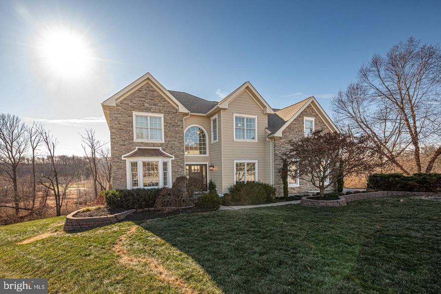 Set amidst the picturesque hills of West Chester, this expansive and beautifully appointed home offers a perfect balance of luxury and tranquility. Located on a cul-de-sac in the Estates of Tattersall, you’ll appreciate the elevated amenities, the open & airy layout, and the expansive views. Highlights include hardwood floors throughout the main level, dual staircases, a beautifully updated kitchen with quartz countertops, a dramatic floor-to-ceiling stone fireplace, a main-floor professional office, and an incredible 1,000 square foot Trex deck offering a sweeping 180-degree panorama. The lovely living room & dining room combination offers the perfect place to gather with family and friends with rich wood moldings, grand columns, and warm natural light.  Flow into the main living space starting with the stunning kitchen, fully loaded with quartz countertops, subway tile backsplash, stainless steel appliances, and a center island with seating. The adjoining dining area—brightened by a cheerful skylight—includes a greenhouse-style extension, an ideal spot for plants and cozy morning coffee. The kitchen opens to the impressive two-story great room with stone, wood-burning fireplace and back staircase. Step out onto the expansive full-width deck and enjoy a front-row seat to the beauty of every season as you dine, relax, and entertain. Back inside, a main-floor office with double-door entry, a half bath, and a fully equipped laundry/mudroom with sink and storage (conveniently located off the garage) complete the main level. Upstairs, you’ll find four spacious bedrooms—two with en-suite baths and two with a shared Jack-and-Jill configuration. The luxurious primary suite features a coffered ceiling, sitting area, expansive walk-in closet, and en-suite bath with double vanity, soaking tub, and glass shower. A full, walkout basement offers endless potential to finish to your liking—create the ultimate game room, home gym, media room, or whatever your needs require. Major system and structural improvements add exceptional value, including newer Hardie board siding, windows and doors, roof (2025), HVAC (2023-2024), hot water heater, and newer carpet in three bedrooms. Situated within the top-rated Downingtown School District and STEM Academy.  You will also enjoy easy access to Routes 1 and 202, and all the best of West Chester.  From its vibrant dining and shopping scene to the celebrated cultural attractions of the Brandywine Valley, including wineries, festivals, Longwood Gardens, and the Brandywine River Museum of Art, just to name a few.  Don’t miss this exceptional home—schedule your showing today!