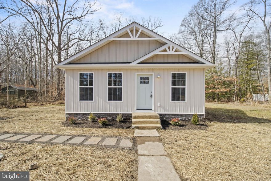 Welcome to the cozy small town feel you've been looking for in North Beach, MD! Situated just outside of  Rose Haven, between popular Herrington Harbour and Downtown North Beach, this home is perfect for anyone who loves the Chesapeake Bay. Beautifully renovated in 2024, the two bedroom one bathroom craftsman cottage features an open floorplan flooded with natural light. Brand new luxury vinyl plank flooring throughout the living room, kitchen and bedrooms. Brand new architectural shingle roof, HVAC system and water heater. Completely remodeled kitchen and bathroom. The kitchen features quartz countertops and stainless steel appliances.  There is a dedicated laundry room with hookups just off of the kitchen. Less than one mile from Herrington Harbour Marina Resort which offers 600 boat slips, a spectacular wedding venue, Ketch 22 Restaurant/Bar, Chesapeake Market & Deli, pool memberships, private beaches and so much more. This would make a fantastic AirBnb opportunity - a local short term property manager has estimated that the property could generate $51,300 of rental income in year 2! Ask to see the pro forma statement. *Ignore number of days on market - we were listed for a few days in February and then temporarily off the market for almost 2 months* Contact the listing agent for a private tour today!