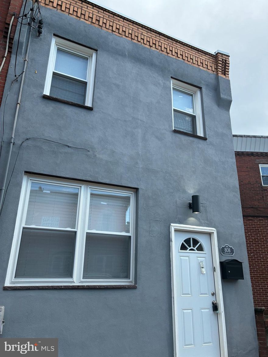 Welcome to this well-maintained 2-bedroom, 1.5-bath townhome located in the heart of Lower Moyamensing. This home features warm wood floors, recessed lighting, and ceiling fans throughout, creating a comfortable and inviting atmosphere. The main level offers a spacious living area and a convenient half bath. Upstairs, you'll find two nicely sized bedrooms, a full bathroom, and in-unit laundry for added ease.
Situated on a quiet block, this property offers easy access to public transportation, parks, and the many local restaurants, coffee shops, and retail options that make Lower Moyamensing such a desirable neighborhood.