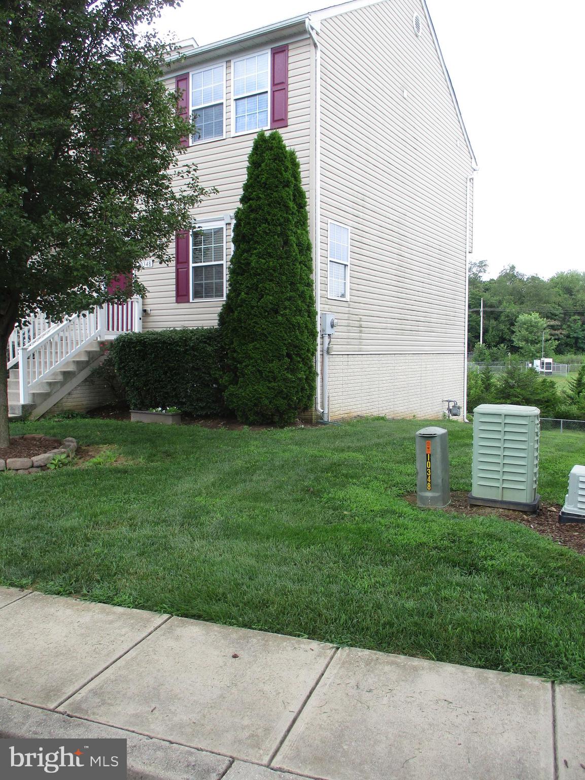 CONVENIENTLY LOCATED 4 BEDROOM/ 3.5 BATH TOWNHOUSE WITH 3 FINISHED LEVELS- LOCATED IN THE CARRIAGE HILL COMMUNITY. THIS HOME HAS BEEN WELL TAKEN CARE-OF BY THE OWNER. THE LOWER LEVEL HAS A LARGE BEDROOM, FULL BATH, LAUNDRY FACILITIES, AND A FAMILY ROOM, THAT WALKS OUT TO A SLATE PATIO, WITH RAISED FLOWER BEDS , AND A FIRE PIT AND A BEAUTIFUL VIEW. THE REAR YARD BACKS TO AN OPEN AREA THAT IS A BUFFER TO THE NEXT COMMUNITY. THE MAIN LEVEL HAS A LIVING ROOM, DINING ROOM, HALF BATH, AND A NICE SIZED EAT-IN KITCHEN- WITH AN ISLAND, THERE ARE SLIDING GLASS DOORS, THAT LEAD TO A POSSBILE FUTURE REAR DECK. THE UPPER FLOOR HAS A PRIMARY BEDROOM WITH A FULL BATH (DOUBLE SINK VANITY) AND A TUB/SHOWER COMBO. THERE ARE ALSO 2 ADDITIONAL BEDROOMS AND A FULL BATH. PLUSES TO THIS HOUSE ARE THAT IT HAS COUNTY TAXES AND ECONOMICAL GAS HEAT. THIS HOUSE IS WORTH A LOOK, AS IT IS PRICED WELL BELOW THE OTHER UNITS IN THE SUBDIVISION THAT HAVE SOLD.