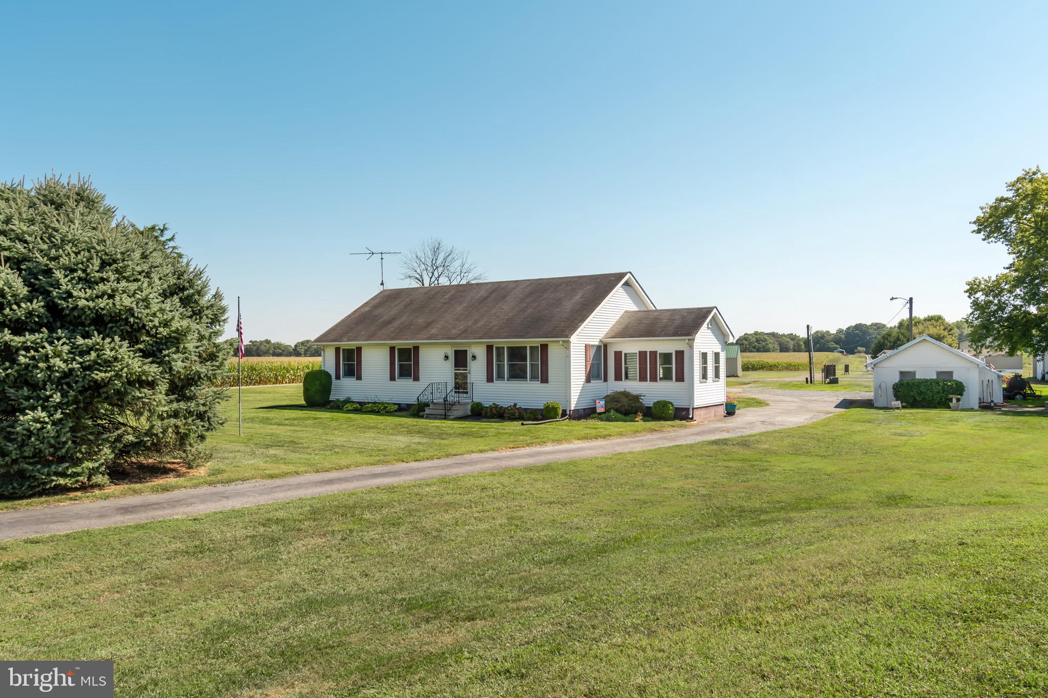 Welcome to your countryside dream home, nestled on a sprawling two-acre haven that’s perfect for both relaxation and adventure! This charming property boasts not one but two fantastic outbuildings—one garage that’s 30 x 30, power garage door opener, and another versatile space that’s 18 x 30. Whether you’re parking a fleet of vehicles or setting up a workshop, you’ll have all the room you need and then some!
Imagine yourself surrounded by lush farmland, just a stone’s throw away from a picturesque park and minutes from the lively town of Rock Hall. You’ll have quick access to public landings, marinas, quirky shops, and mouthwatering restaurants. And let’s not forget, the beautiful Chesapeake Bay is right around the corner, promising endless fun and adventure.
Step inside this delightful home and discover a fresh, updated space with plenty of personality. The cozy side sitting room is your new favorite reading nook, where you can unwind with a good book while enjoying the view of your lovely yard. The kitchen has a good work flow with ample space for your table and a seamless flow into the living room.
Three charming bedrooms and 1.5 modern baths ensure comfort for everyone, and the whole house fan, paired with a new HVAC system (only 2 years old!), keeps things cool and breezy. The house has a bit of Cape Cod potential with a spacious, mostly floored attic just waiting for your creative touch.
Outside, there’s plenty of room for your four-legged furry friends to romp around and enjoy. This home offers the perfect blend of tranquility and convenience, making it a truly wonderful place to call home.