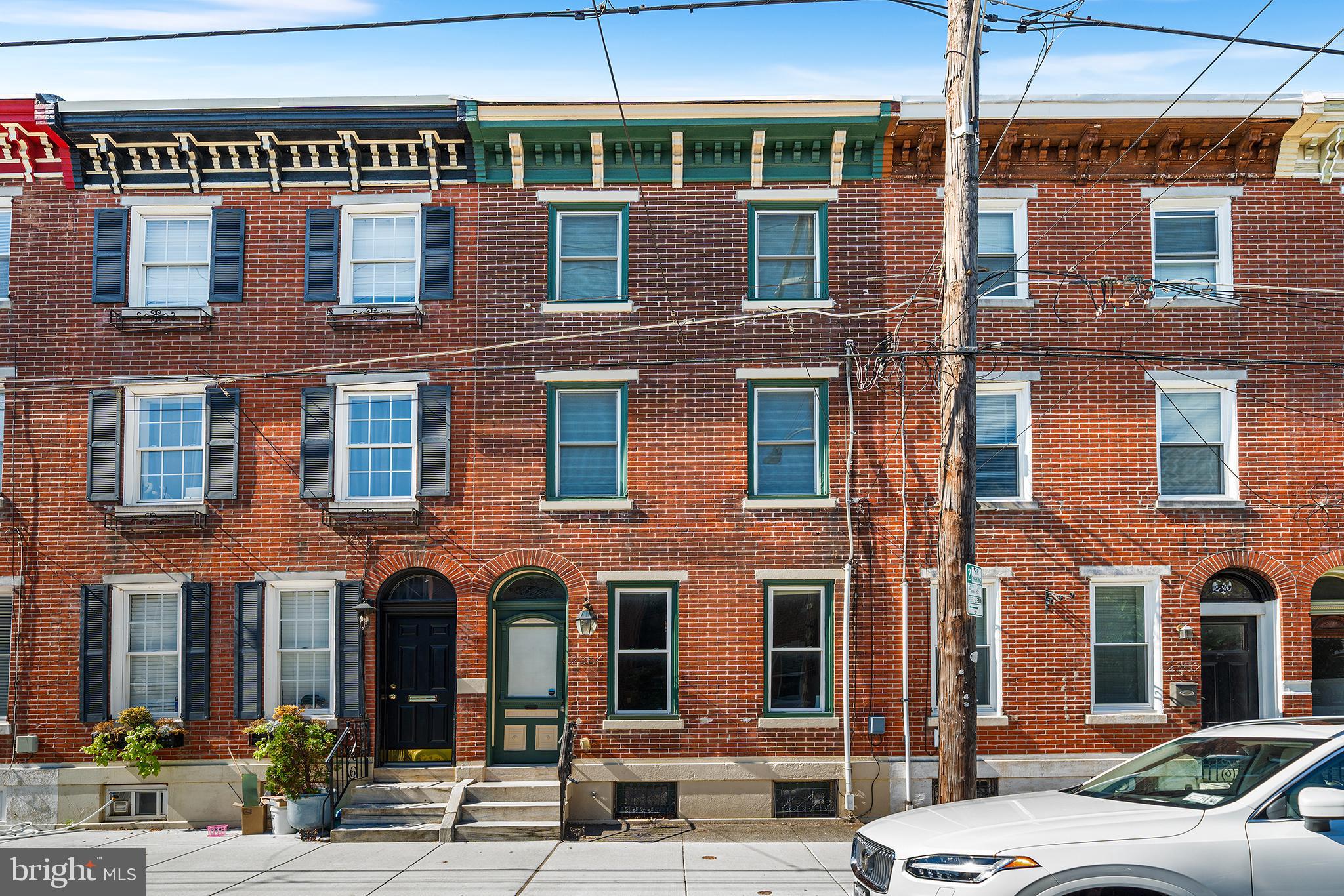 Welcome to 2354 E Norris Street, a beautifully styled three bedroom, two and a half bathroom home that is perfectly situated on one of the most coveted blocks in Fishtown. When you step inside this home you will immediately notice the abundance of natural light flowing from the two front windows and rarely found side windows working together to create a bright and inviting ambiance in the open concept first floor space. A custom designed stained glass fish in the transom window above the original solid wood front door provides a charming vintage accent. The first floor is anchored by gleaming hardwood floors that showcase the chic, cohesive and neutral palette of the home’s design. These hardwood floors continue throughout the upper levels of the home. The living space itself is perfectly sized with ample space to add a dining room table. The L-shaped kitchen space is smartly designed with crisp white cabinetry accented by stainless steel appliances including a gas range, a cool gray-tone backsplash and white quartz countertops. Directly off the kitchen is an outdoor brick patio, which is an ideal setting for hosting fall gatherings around a cozy fire pit. A powder room is smartly tucked away behind the kitchen. On the second floor, you will find two guest bedrooms with a full bathroom conveniently located between them. The front guest bedroom features a walk-in closet. The rear guest bedroom, while smaller, is the perfect space for a home office. The primary suite encompasses the entire third floor, with a cool open design, walk-in closet and an en suite primary bathroom complete with a walk-in glass door shower. Downstairs, the basement is dry, has good ceiling height and offers a generous amount of organized storage space thanks to shelving added by the current owners. This home is just steps from foodie favorites: Loco Pez, Cedar Point Bar & Kitchen and Amy’s Pastelillos. Its location makes it oh so easy to grab a coffee at ReAnimator and stroll down Norris Street to Riverwards Produce for some locally sourced groceries. This charming Fishtown home is your opportunity to embrace the quintessential Philly lifestyle and is just waiting for you to make it your own. Located in the Alexander Adaire Elementary School catchment.