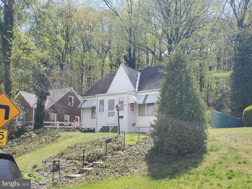 This home has the potential to be very very cute.  It has a screened rear patio, small back yard and backs to wooded Mount Penn.  This is your playground if indeed you are a fan of hiking and exploring! The house is in need of updating and being sold in "As-Is" condition.  The furnace and central air are fairly new & working well.  The roof does not leak and has not leaked in the 15 years this seller has lived there.  There is original hardwood flooring on the entire 1st & 2nd floors with the exception of the kitchen & baths.  The 2nd floor master bedroom is large and adjoins the full bathroom.  A really nice feature in this home is 2 full baths, 1st & 2nd floors, which is nearly impossible to find in homes this size.  It's time for someone to take this property to it's Full Potential!