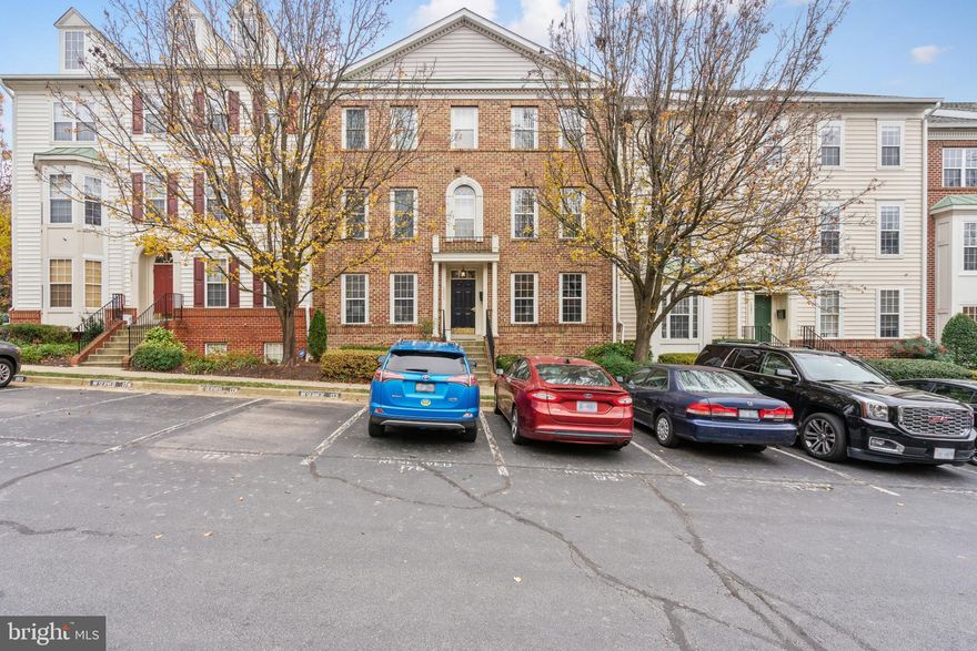 2 level luxury townhouse condo w/ many upgrades. Eat-in kitchen w/ 42" cabinets, tile floors, gas, granite counters, & under-mount sink/faucet. Kitchen opens to quiet balcony & green space. Open plan w/ high ceilings, living/dining room w/ crown molding & hardwood. Double sink MBA. Hardwood in MBR w/ crown molding & bay window on main floor. Cozy family room. Secondary bedroom downstairs has a sliding glass door for backyard access. Assigned Parking. Just blocks to Silver Line Metro. Rentspree applications only!