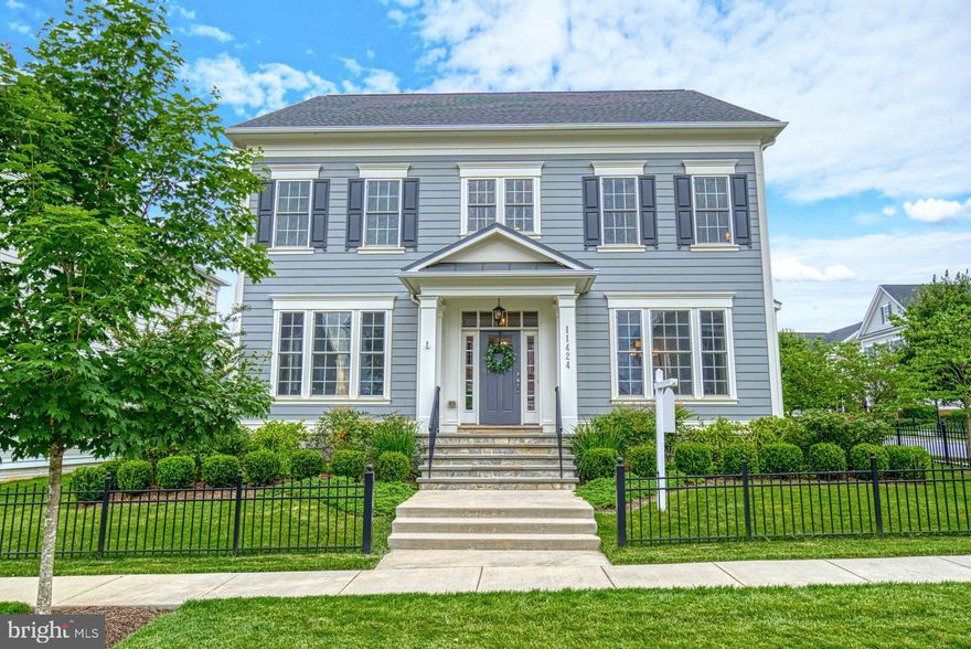 THIS is Maple Lawn!   Welcome!  This Manchester Model has one of few rarely available attached 3-car, rear entry Garage homes (w/high-power Tesla supercharger – can charge up to 100amps) **Mitchell & Best added $120,000 worth of options into this home. The Options List has been uploaded to the document portal. As detailed in the Options List, do note all the extra windows in the living room, dining room, family room and eat-in kitchen. While this model retains the charm of a classic colonial with a large center hall, shadowbox molding, wainscoting, chair railing, and two-piece and three-piece crown molding - it also reflects a modern style with its updated light fixtures, generous recessed lights, paint colors, coffered ceiling in the family room and a versatile layout to entertain, relax and work. The office space has been customized with seagrass wallpaper, hard-wired ethernet, built-in custom, shelving including a desk with a native walnut top.  Crisp, white and blue accented eat-in kitchen  with a butler’s pantry, includes a center island with pendant lighting, under cabinet lighting, 36” cooktop with 6 burners, 36” French door refrigerator and plenty of room for cooking. Two not-to-be-missed features off the Kitchen: A Mudroom with built-in shelving and benches and a Walk-In Pantry installed by California Closets. Family room off the kitchen showcases a gas fireplace which makes for an ideal setting for curling up to watch a movie or to indulge in a good book. Family Room also overlooks a beautiful flagstone patio courtyard with ample room for seating and al fresco entertaining. Dining Room is elegant and intended for entertaining in style. Living Room impresses with large windows and abounding in natural light. Moving upstairs, another unique, custom feature awaits: A landing set up as a cozy sitting room with built-in seating, drawers, bead boarding, recessed lighting and fanciful cushions. It is simply divine! Primary Suite is a true sanctuary with crown molding, large dressing area and two walk-in closets installed by California Closets. Additionally, the upper level also incorporates a laundry room, three bedrooms and two full bathrooms, one of which is an en-suite. . The finished basement is an expansive space and presents a recreation/game room, a den and a fifth bedroom  and adjoining full bathroom. The bedroom is an exceptionally large space perfect for a guest suite. Completing this level is also a large storage room. Other amenities of the house include: 7-zone irrigation system making lawn care a breeze; Passive radon system; 2-zone Carrier HVAC system; Yard is beautifully landscaped and fully fenced. All windows with the exception of the upper level sitting area , living room and dining room all windows have wood blinds.