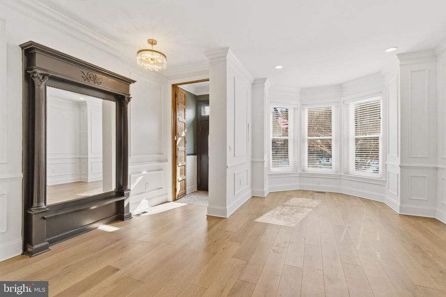 An Extraordinary Grand Victorian in the Heart of Columbia Heights could be yours. 

Welcome to this truly exceptional Grand Victorian townhouse, a seamless fusion of historic elegance and contemporary luxury, nestled in vibrant Columbia Heights/ U Street. Spanning four meticulously designed levels, this stately residence has been transformed by its architect-inspired owners into a one-of-a-kind custom home.

From the moment you enter, the attention to detail is evident. The heart of the home is a Chef’s Gourmet Kitchen—an entertainer’s dream—featuring dual 10-foot islands, matching Cafe Commercial stainless steel appliances which include a 6-burner gas cooktop with a powerful canopy hood. There is an abundance of storage within custom shaker cabinetry topped with stunning Calcutta Quartz counters from Cambria (the Highest grade was installed and has a lifetime warranty).

Though this early 20th-century gem already had strong architectural bones, the current owners envisioned more than a renovation—they undertook a full-scale transformation. What began as a kitchen and bathroom update evolved into a comprehensive reimagining, including brand new flooring throughout entire home, brand new staircases, NEW HVAC/Central Heating system (previously radiator heating), tankless water heater, drywall, electrical systems, staircases, and ceilings. Recessed and statement lighting fixtures have been installed throughout to bring warmth and sophistication to every room, especially the oversized bedrooms w/elegant ceiling fans. 

Original updated wall moldings accentuate the soaring ceilings and mirror/wall trims on each level, while rich textures and bold colors define the ultra-luxurious bathrooms. The home retains its original character with orginal 1910 preserved wood-burning fireplaces, hallway entry mirrors (amazing millwork), and stained glass in the living and dining rooms (Restoration Hardware chandeliers will convey), blending old-world charm with modern flair. Let's not forget the stunning wide plank engineered white oak flooring that has been installed throughout this fabulous home. 

Upstairs, a former bedroom has been reconfigured into a lavish walk-in closet for the primary suite, built by California Closets, leading to what can only be described as a “bathroom of the century,” complete with leather-embossed wall finishes and gold-accented hardware for an unforgettable spa-like experience.

A private, screened-in rooftop deck with fabulous views awaits just beyond the home office or guest suite—your perfect hideaway above the city (this could also be converted to another room if needed).

The fully finished basement includes its own private entrance with a full kitchen and washer/dryer- offering endless flexibility as a guest suite, in-law apartment, or potential income-generating unit.