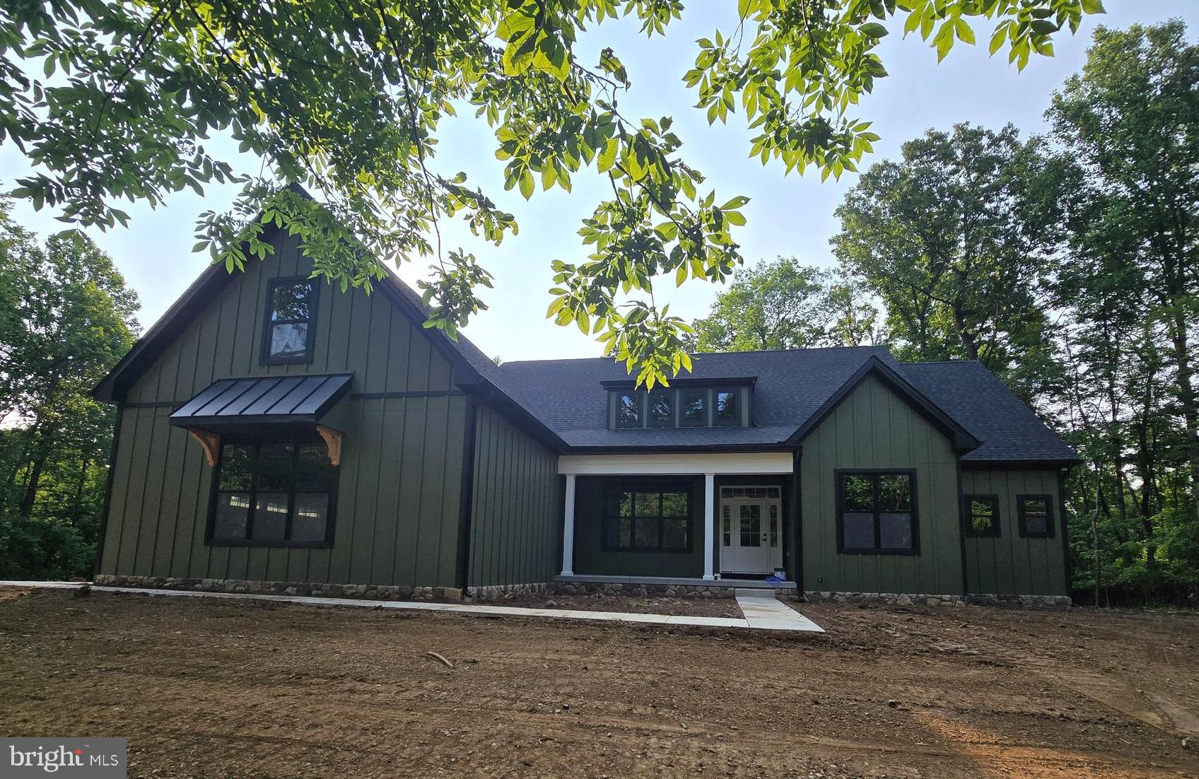 This home will have Sage Green Hardiboard siding. Enjoy the best of both worlds—peaceful country living with convenient access to everything you need. This 3.1 +/- acre homesite is located in a well-established community known for its desirable location and friendly atmosphere.
Your new home will be a beautifully built 4-bedroom, 4.5-bath Farmhouse ranch-style, designed with comfort and quality in mind. The open floor plan features vaulted ceilings, luxury vinyl plank flooring, solid surface countertops, and soft-close cabinets. The kitchen comes with a full appliance package—already upgraded—so you're ready to cook and entertain from day one.
There's a full unfinished basement for storage, hobbies, or future living space. The home is thoughtfully laid out for easy, one-level living, with a finish upper level bedroom and full bath with plenty of space for guests, grandkids, or quiet relaxation.
Outside, you’ll have more than three acres to enjoy—ideal for gardening, outdoor gatherings, or just soaking in the peaceful surroundings. And while it feels like you're out in the country, you’re just minutes from local parks, schools, shopping, and other amenities.
Photos shown are of similar homes to give you an idea of the style and finish. This home is scheduled for August 2025 delivery, giving you time to plan and prepare for your next chapter.
Come settle in a place that offers comfort, space, and a true sense of home.