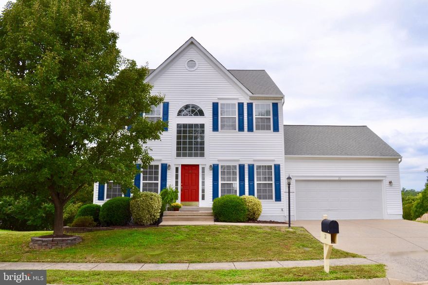 This beautiful, well maintained home is move in ready!  It has a bright, open floor plan, with a palladian window and two story foyer. It is updated with new carpet, upgraded wide plank flooring, fresh paint, lighting and appliances. The main level has 9 foot ceilings and a waterfall back staircase. There is a formal living room and separate dining room with upgraded engineered vinyl plank flooring and decorative moldings.  The gourmet kitchen has new beautiful granite counters, stainless appliances, a pantry and upgraded engineered vinyl plank flooring.  In addition, there is a lovely breakfast nook with a sliding glass door which leads to deck overlooking the treed backyard.  Relax in the spacious family room which has a ceiling fan and gas fireplace with a decorative wood mantle. Retreat in the large master suite offering a double door entry, ceiling fan, wall of windows,a huge walk-in closet and a secondary closet.  The luxury master bath has large soaking tub, separate shower, double vanity, new upgraded engineered vinyl plank flooring and linen closet. All the additional bedrooms are spacious with large closets.  Walking down to the lower level, there is a finished recreation area with recessed lighting, an additional bedroom and full bath along with an unfinished storage and utility room. The home is dual zoned, making it more energy efficient.  Don t miss the opportunity to own this wonderful home situated on a cul-de-sac lot in a quiet established community.  It is located within minutes from Quanitco, Government Island Park, Route 1, I-95, commuter lots and all amenities making living here a commuter s dream!!