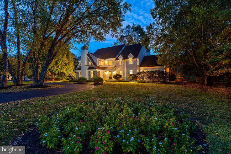 Perfectly positioned on a quiet cul-de-sac in one of Gwynedd Valley’s most coveted neighborhoods—Meadowview Farms—this Ann Capron–designed, Guidi-built farmhouse blends timeless architecture with modern flexibility. Offering nearly 5,000 sq. ft. of living space, plus an additional 1,200 sq. ft. finished lower level, this 5-bedroom, 4.5-bath home is beautifully sited on 1.21 lushly landscaped acres. A circular drive with landscaped center island and a premier lot setting make an unforgettable first impression. The refreshed exterior showcases a handsome blend of stone, cedar, and stucco, and mature plantings that frame the flagstone walkway leading to the front door. Inside, the home feels crisp and inviting with fresh, neutral paint throughout, gleaming hardwood floors, and custom built-ins that enhance every space. The refreshed kitchen—with fireplace and adjoining breakfast room—enjoys spectacular views of the private rear yard and opens to a flagstone patio ideal for alfresco dining. Additional fireplaces in the family room, owner’s suite, and sunken living room add warmth and character throughout. Upstairs, four spacious bedrooms include a primary suite with sitting room, fireplace, 2 walk-in closets, and updated bath with an oversized jacuzzi tub. Two rear bedrooms share an adjoining bath, while another features an en-suite layout. The fifth bedroom suite, with private access, full bath, and cedar closet, provides wonderful flexibility—ideal for an au pair, in-law, guest suite, or home office. The partially finished lower level offers a large recreation area, dedicated craft space, and room for a future home gym or wine cellar, while still maintaining generous storage. The full-size walk-up attic offers yet another opportunity to expand, making this one of the most versatile and customizable floor plans in Meadowview Farms. A true value-add, the detached two-car garage provides endless potential—convert it into a carriage house, guest quarters, or studio, adding even more living or work-from-home space. Located in the top-ranked Wissahickon School District, with convenient access to Springhouse Shopping Center, Route 309, the PA Turnpike, and local dining, this exceptional property offers the perfect blend of timeless design, flexibility, and location—all in the heart of Gwynedd Valley. Call for your showing TODAY!