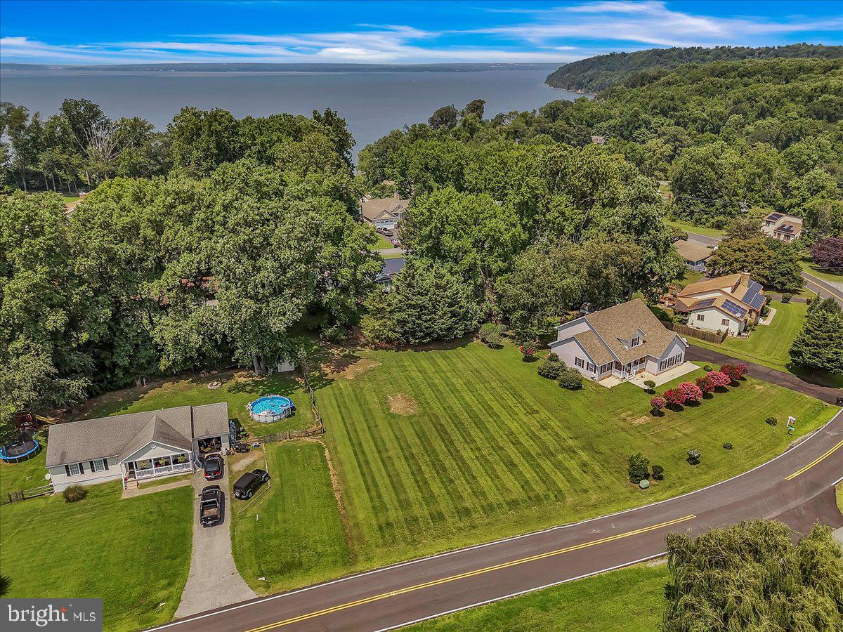 Building lot in sought after Chesapeake Isle Community. Discover the endless potential of this level, perc-approved lot nestled on Turkey Point Rd. Surrounded by Elk Neck State Park and close to Turkey Point Lighthouse, this peaceful setting offers the perfect blend of seclusion and accessibility.
Located minutes from the charming waterfront town of North East, MD.
Chesapeake Isle is more than just a neighborhood—it’s a lifestyle. The isle is a community of 300+ properties sandwiched between parts of Elk Neck State Park in North East, Maryland.
It features a beautiful beach area and private harbor on the Elk River adjacent to the Turkey Point Lighthouse. Enjoy access to exclusive amenities like a private boat ramp, community park, pavilion, basketball and volleyball courts, and more. This lot offers unmatched flexibility and value.
Opportunities like this are rare—and this one is priced to move. Bring your vision and make it a reality on Turkey Point Road!
Lot is located in between 5185 and 5207 Turkey Point Rd.