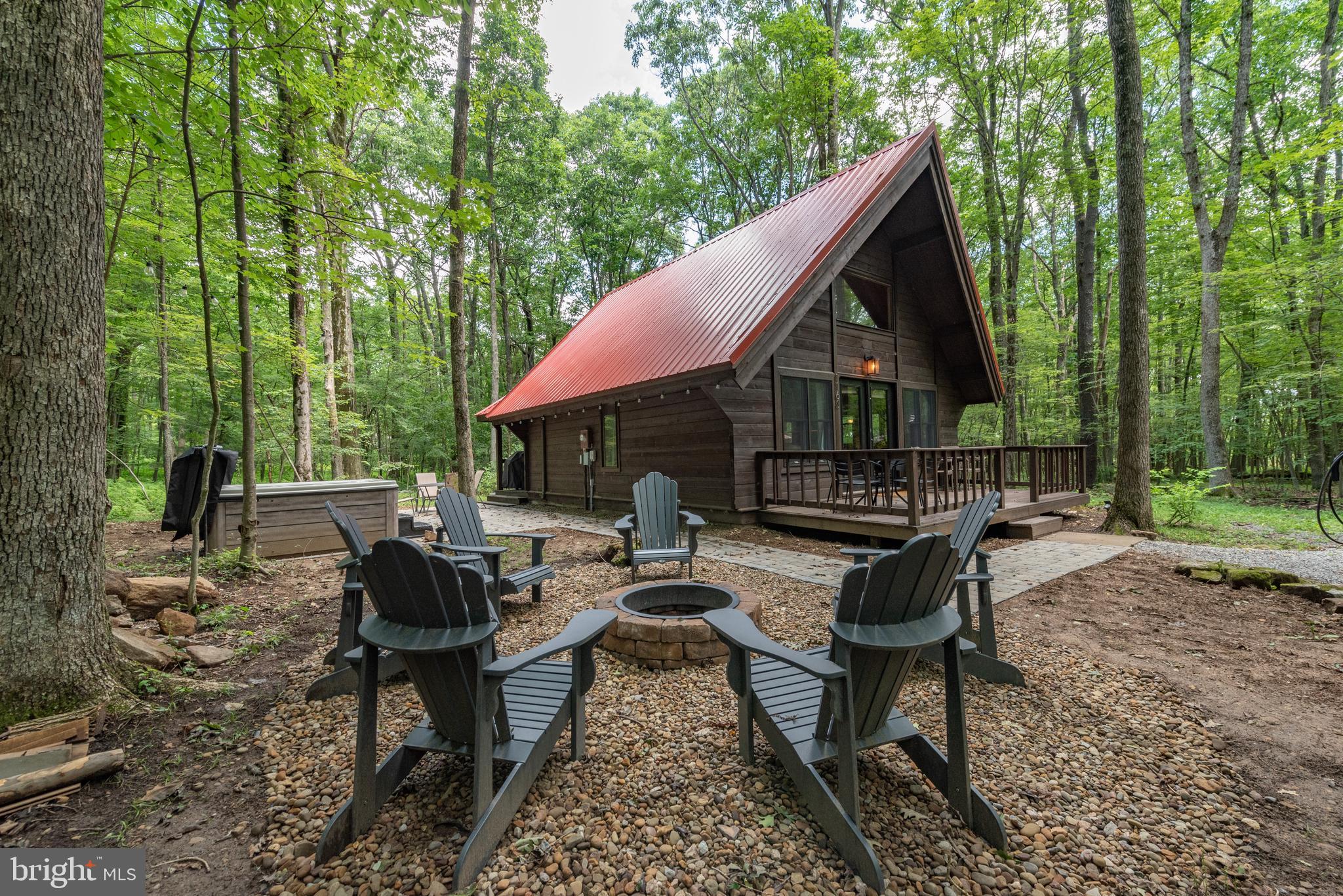 Looking for that perfect cabin in the woods basecamp? This gorgeous 2 Bedroom 2 Bathroom cabin is perfectly situated in a wooded neighborhood 5 minutes from all of the area amenities - Deep Creek Lake Marinas, Wisp Ski Resort, Swallow Falls State Park, the Community Aquatics & Recreation Complex
and much more. Currently a successful vacation rental property some of the new improvements include mini-split heat/ac units throughout, new exterior staining, new Viking Hot Tub, new firepit and hardscaping. There are many more recent upgrades (too much to add here) so contact agent for more details. This could be the perfect cabin in the woods you've been looking for!