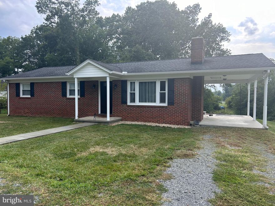 Reduced! Lovely Brick Rambler with many upgrades, Nice kitchen with solid wood cabinets, wood floors, full basement partially finished, nice back yard, carport. Some interior painting is being done. Comcast available. 3 bedroom Septic.
