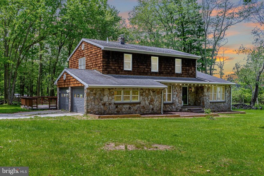 Welcome to your next dream home! Nestled on a 4-acre wooded lot, this custom built traditional-style residence combines comfort, and convenience. Just minutes from Broadford Lake Park, healthcare, shopping, Deep Creek Lake, and Wisp Ski Resort, this peaceful property offers easy access to all the local amenities. Two story stone & cedar, 4BR, 2.5 Bath w/ 2 - car attached garage, & 2 - car detached garage. Property is in excellent condition. 4 Parcels included in sale: Parcel 3, 4, 17 & 18. All hardwood flooring & ceramic tile, chefs kitchen with quartz counter tops. Both attached & detached garages could hold boats & jet skis for trips to Deep Creek Lake. Boasting spacious bedrooms, 2 full bathrooms - including 1 custom tile shower. With Newly Installed Garage Doors, the attached two-car garage and detached garage with utilities is ideal for boat/car storage. The open floor plan connects the kitchen, breakfast nook, living room, and dining area, which is ideal for entertaining. Outdoor living is exceptional with a porch, expansive deck, patios, perfect for gatherings or peaceful evenings. Custom woodwork, hardwood floors, quartz counter tops, and 2 fireplaces add elegance throughout. Outdoor enthusiasts will love the access to Broadford Lake Park as well as the short drive to Deep Creek Lake & State Parks for Almost Heaven adventures. Zero - Turn Mower included!!! This feature packed home is a must-see!!! Schedule your private viewing today!