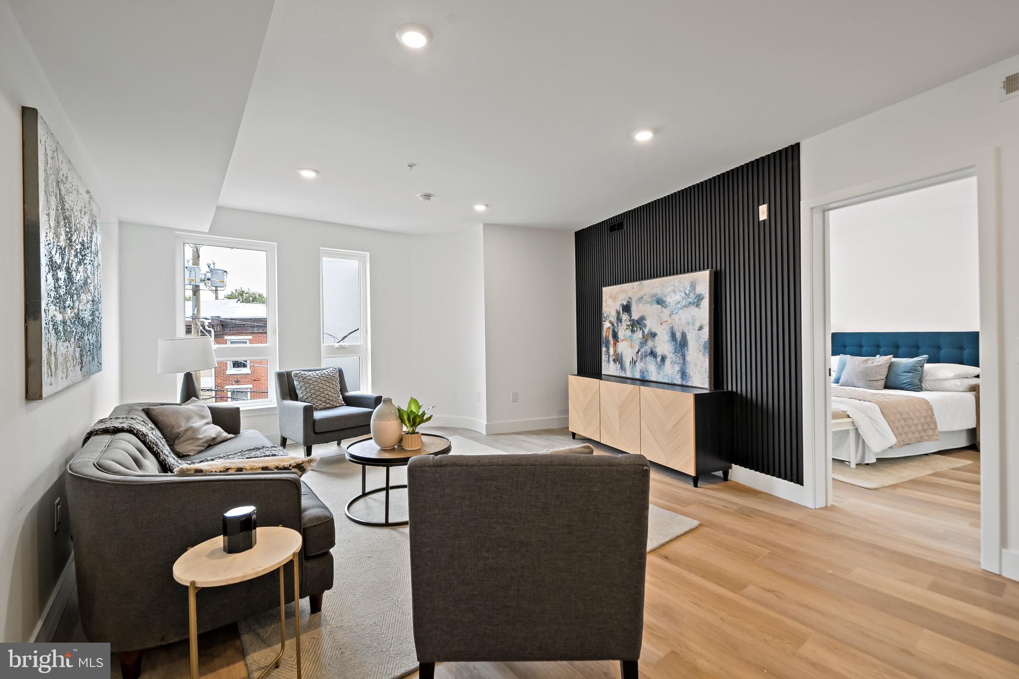 Welcome to Fifteen38 Flats, the newest luxury boutique condo building in the heart of Fishtown. Unit #4B, a spacious 1,200-square-foot residence, offers 2 bedrooms and 2.5 bathrooms, all beautifully designed. The kitchen features custom white cabinetry, quartz countertops, and stainless steel appliances, flowing into a bright, airy living room. The bathrooms boast curated tiles, elegant vanities, and modern black fixtures. The building provides a private, secure entry off Frankford Avenue, with an elevator leading to each floor and a massive rooftop deck. Enjoy dramatic Center City Skyline views and a large dog run for your furry friend. Located next to Philly’s top restaurants and bars, this home combines luxury and convenience. Plus, take advantage of a special interest rate with a 2-1 buy-down that the seller will cover. Check with the listing agent for the latest rate updates and other exclusive offers. Fifteen38 Flats is more than just a home; it’s a vibrant lifestyle in one of Philly’s hottest neighborhoods.