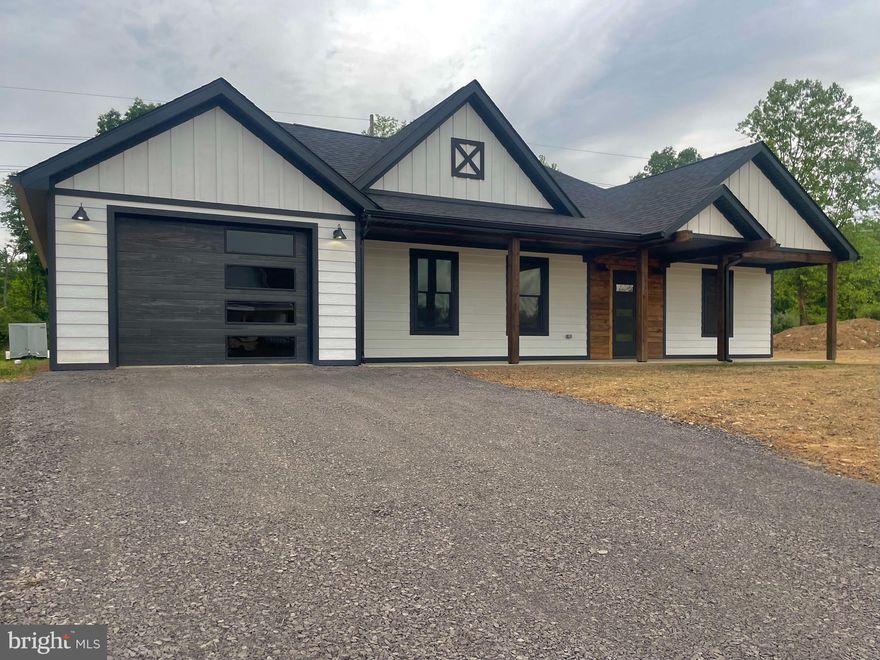 A beautifully built new construction home has just hit the market and awaits its very first owner! Modern meets rustic with this contemporary piece of eye candy.  Butcher-block countertops, soft-shut cabinets from Prime Cabinetry, crown molding, new black stainless steel Frigidaire stove, dishwasher, and Built-in microwave, double hung and energy efficient windows throughout, LED and recessed lighting features, central air and heat, L-Piece smart siding, a vaulted pine ceiling in the living area, Therma-tru patio doors,  a beautiful covered rear patio with vaulted pine framework, a one car garage, and advanced framing with an embellished hip roof are just some of what this stunning home has to offer! Located in the newly expanded Kessell Estates with a freshly paved road and the recent installation of public sewer! Book your showing today!