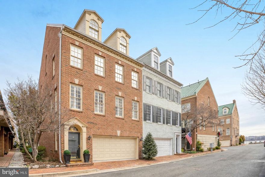 *Expected on market 2/5/26*

Rarely available Federal-style end-unit townhome in one of Old Town’s most desirable neighborhoods, just steps from the Potomac River, waterfront parks, and King Street. Fully renovated, this home offers nearly 3,000 sq ft with natural light, high ceilings, and high-end finishes throughout.

The main level features an open layout ideal for entertaining, with a built-in electric fireplace in a modern tiled feature wall, hardwood floors, and plantation shutters. The kitchen with white cabinets, quartz counters, and glass tile backsplash opens to a private balcony.

Upper levels include generous sized bedrooms, spa-inspired baths, and flexible space for an office or guest suite. The primary suite offers a vaulted ceiling and large windows, providing a bright and tranquil retreat.

The walk-out lower level features a mini kitchen and built-in media area with fireplace, opening to a private brick patio and grass courtyard — the only one of its kind in Ford’s Landing. A side garden with ornamental trees, perennials, and a pathway provides additional outdoor space.

Enjoy effortless access to the Mount Vernon Trail, waterfront parks, restaurants, boutiques, and Metro—exceptional Old Town living at its finest.