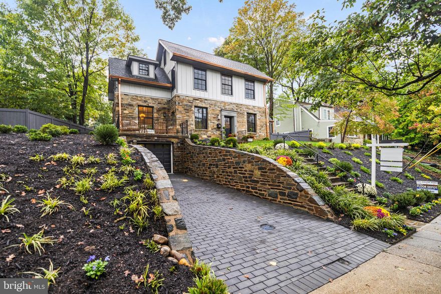 Built in 1938, this completely renovated residence maintains its original sensibility while offering a new and captivating interior.  The right amount of additional space has been seamlessly integrated into the existing house, with exterior finishes that are consonant with the period in which it was built.  Dilan Homes has transformed what was once a modest and dignified house into a luxurious home with spaces on three finished floors that were rationally and carefully considered, comprising more than 4,000 square feet.  The house occupies a handsome lot with an approach that is sited well above the street; a quiet space is found within. The main level claims attention immediately with its 10-foot ceilings and gracious floor plan.  The main living space, kitchen, and dining area are all inviting, affording the occupants an opportunity to entertain on a very generous scale.  The kitchen has been outfitted with a large pantry that may also serve as a prep area and space for small appliances.  Accessible from the kitchen is an original porch which has screens on all sides for maximum utility.  A library off the front hall can be used as a private sitting room, office, or space to entertain guests on a more intimate scale.  Found on this floor is a powder room, den, and balcony from which the view can be enjoyed in all seasons. The second level offers a spacious primary suite with a walk-in closet large enough to serve as a dressing room.  The second bedroom has an ensuite bathroom, generous closet, and a separate space which can be used as a den.  The third bedroom has also been created with an ensuite bathroom, making all three bedrooms equally well-planned and comfortable.  This level also has been outfitted with a separate laundry room and two linen closets. The lower level feels as comfortable as the upper two levels and offers a family room, bedroom with full bathroom, a second laundry, and entrance to the garage.  The garden has also been as thoughtfully considered as the rest of the house, with a flagstone terrace and new plantings framing the lot.