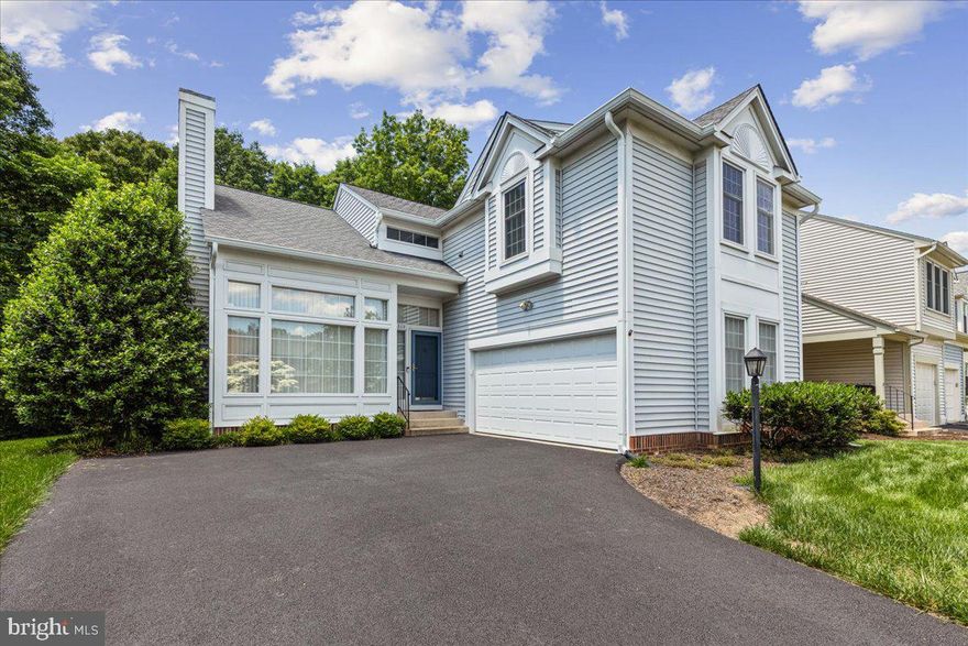 Beautiful end unit two-car garage townhome exudes the charm of a single-family home! Situated in the highly coveted Green Trails, this residence has been impeccably maintained. Upon entering the front door, you will be bathed in natural light from the expansive window and open floor plan. The main level showcases an inviting family room spacious enough for the entire family, featuring soaring ceilings and a cozy fireplace. Adjacent to the family room is the dining area, seamlessly connected to the exquisitely remodeled kitchen, which boasts granite countertops, rich cabinetry, and top-of-the-line stainless steel appliances. The kitchen also includes a generous peninsula, perfect for cooking or entertaining, and the eat-in area conveniently opens to the low-maintenance Trex deck and backyard, providing a serene private space to enjoy. 
The rarely available two-car garage is exceptionally spacious, and the expansive driveway offers ample parking for family and friends or serves as an excellent play area for children. Green Trails is an outstanding community offering a community center and pool, tennis courts, tot lots, a multi-purpose court, walking trails, and summer food trucks. Don't miss this rare opportunity to own a model with a two-car garage! Windows have been replaced, Hvac and water heater approx 2013, roof age unknown, new top of the line thermostat with temperature sensors outside located under deck.