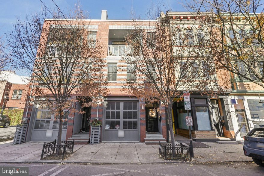 Welcome to 739 Bainbridge Street, a spacious three-story 4 bedroom, 4 full bath home with private one-car garage PARKING, ideally situated in the heart of Bella Vista/Queen Village within the sought-after Meredith School catchment. Completed in 2016, this modern residence offers sophisticated design, high-end finishes, and exceptional outdoor living. The gourmet kitchen is a chef’s dream, featuring a Wolf gas range, Sub-Zero refrigerator, sleek white cabinetry, marble countertops, and a marble waterfall island with bar seating, all open to the light-filled living and dining area. The living room is centered by a gas fireplace and framed by large windows overlooking the private patio - the perfect setting for relaxing or entertaining. Hardwood floors and recessed lighting are featured throughout the home. The 4th bedroom located in the finished basement is currently being used as a living area, complete with a full bath, wet bar, and a large utility room for storage space. The second floor features two spacious bedrooms, each with its own ensuite bath and double closets with custom shelving, along with a convenient laundry room including a sink and storage cabinets. The rear bedroom accommodates a king-sized bed, with the bathroom featuring a floating vanity and glass door tiled shower. The front bedroom is equally spacious, fitting a king-sized bed, with large windows bringing in plenty of natural light. The full bath was recently upgraded, with a stone-top vanity and glass enclosed tub shower with subway tile surround. The third floor hosts a versatile room currently used as an office, and the impressive primary suite with two walk-in closets, a private balcony, and an upgraded spa-like bath with a double vanity, glass-enclosed shower, heated tile flooring, and heated towel rack. The expansive roof deck, recently resealed, showcases panoramic views of the Center City skyline, an amazing space for entertaining and the perfect spot to enjoy the Penns Landing fireworks. This home is in a superb location, walking distance to South Street, grocery shopping at Whole Foods and ACME, the Italian Market, and an array of local favorites including Little Fish BYOB, Saloon, Fiorella Pasta, Taco Heart, The Sweet Life Bakeshop, and Isgro Pastries, with easy access to all that Center City has to offer.