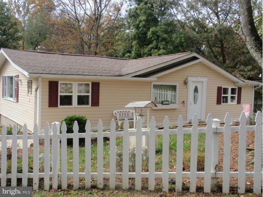 Charming Cottage! Must see this 3 bed/2 bath home w/upgrades. Country kitchen w/sep dining room. Lg stone wood burning fireplace. FR has built-ins and newer laminate floors. Master has bath w/ new stacked w/d. Lg deck w/ stairs overlooks large fenced yard and shed. newer A/C 2011. Walk-in crawl space enhanced. Recent septic inspect/pump-out. Lake Access! NO HOA! Text LA for showing and combo.