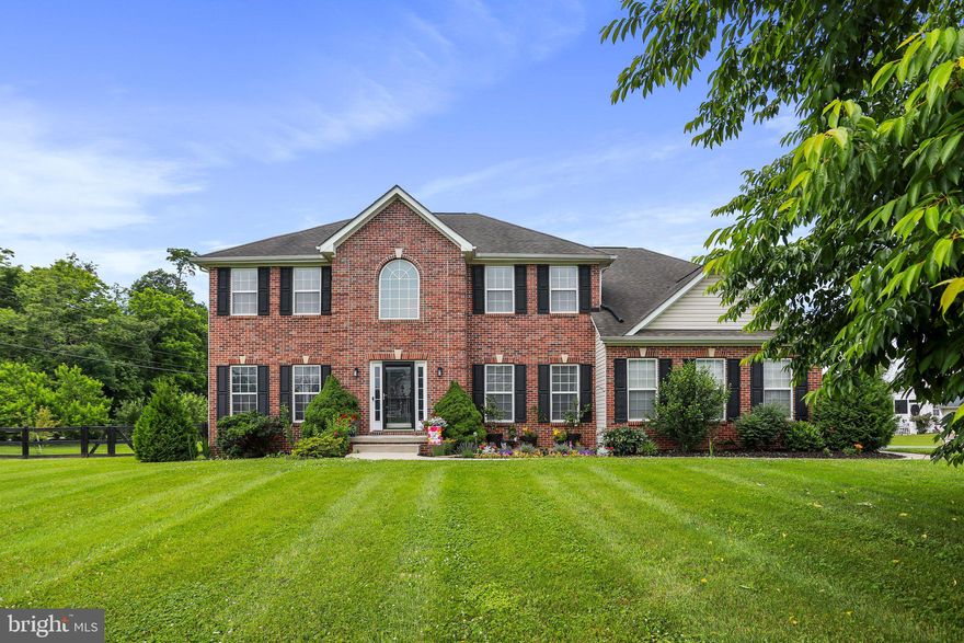 Incredible opportunity to make this spacious home yours! It comes with all the bells and whistles you'd expect from a former model home. Built on a 0.93-acre corner lot with fenced backyard, raised beds, and playset. Trees and well-manicured landscaping surround the home. Inside, the kitchen has just been upgraded, with new LVP flooring, quartz countertops, and subway tile backsplash. Hardwood floors were just refinished too! Also on the main floor is a laundry room and an office, perfect for working from home (high speed internet is available through Xfinity). Family room with gas fireplace and formal dining room complete the main level. Upstairs you'll find an incredible primary suite with massive walk-in closet, sitting room with double-sided fireplace, and bath with brand new tile, vanity, and shower. The finished basement has plenty of storage, a large recreation room, full bath, and another room that is currently used as a bedroom. There are walkout stairs to the backyard. You won't lack for parking with a two car side-entry garage plus large paved driveway. Conveniently located close to historic downtown Shepherdstown, Morgan's Grove Park, and Route 9. Come see for yourself: schedule a showing or visit the open house on Sunday, 6/19, between 1 and 3 PM!