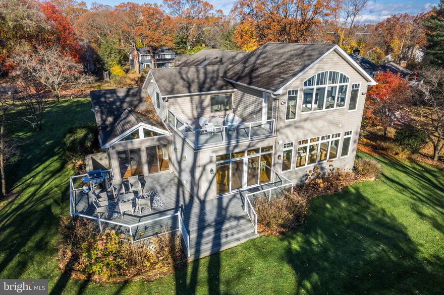 Just in Time for Boating Season!   Enjoy Sailing the Chesapeake Bay and then Dock Your Boat in Your Deep Water,   Private Protected Pier with 4 Slips.  Your Guests will have as Much Fun in Your Coastal Light and Breezy Home as they Did on the Water!  An Entertainer's Delight this 3537 Finished Square Foot Home on Private .65 Acre Lot with Commanding Deep Water Views  has Close to 1400 SF of an Open Great Room Kitchen with Walls of Windows Overlooking the Parklike Grounds and Water.    Kitchen with Large Island, Granite Counters and SS Appliances is Open toward Great Room with Plenty of Seating, Gas Fireplace and Large TV Viewing Area.   An Easy Transition from the Great Room into the Decks for Outdoor Grilling and Socializing as Well.   Main Level also has Dining Room with Water Views, Powder Room and Warm Living Room as You Enter.    After a Day of Entertaining, You will Relax in Your Primary Bedroom with Gas Fireplace, Walls of Windows and Private Balcony All Overlooking the Water.  Upper Level Balcony has been Reinforced in Case you Would Like to Install and Relax in Your Private Hot Tub Private As Well.  Primary Bathroom has 2 Walk In Closets, Jetted Soaking Tub, Stand Alone Tiled Shower and Dual Vanity with Granite Counters.  The Upper Level Laundry Room with Utility Sink Allow Quick Easy Loads of Laundry to be Completed.  Three Additional Bedrooms and Two Full Bathrooms Provide Plenty of Space for Everyone.  Lower Level with Walk Out Steps is Terrific for Storage and Can Easily Be Converted Into Finished Space for Teenagers, If Needed.  Your Home is Located in a Small Quiet Community of Weatherly at the Very End of the Road---no Thru Traffic!  Community has Sandy Beach ck and Pier.  Annual Dues are just $300!  Your Very Special Home is Just Minutes from Downtown Annapolis and an Easy Commute to DC and Baltimore.  Broadneck Blue Ribbon Public Schools.  Welcome Home to Your Waterfront Home in Weatherly.