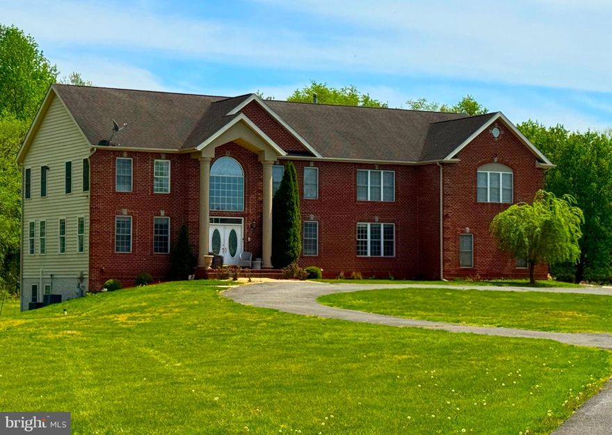 Spacious brick-front colonial set on 10.82 private acres in the heart of Bowie, offering an exceptional blend of space, privacy, and convenience. This impressive residence features gleaming luxury vinyl plank (LVP) flooring throughout the main level, including the staircase and hallway (updated November 2022), creating a cohesive and modern feel. A grand dual staircase enhances the home’s elegant entry, while the thoughtfully designed layout supports both everyday living and effortless entertaining.

The expansive primary suite serves as a luxurious retreat, complete with a dual-sided fireplace, soaking tub, and separate shower. Multiple living spaces include a formal living room, elegant dining room, private office, and a spacious family room with fireplace. The third bedroom features its own private bath, ideal for guests or multigenerational living. A finished basement provides additional flexible space for recreation, fitness, or media use. Laundry is conveniently located on both the main and lower levels.

Recent and notable upgrades include: new dishwasher (upstairs), UV water filtration system (2022), Culligan water softener (March 2023), radon mitigation system (2022), propane tank (2023), and a new well pressure tank (2026). Well pump has been inspected and is in good working condition. Primary bedroom carpet was replaced in 2022.

The side-load 4-car garage offers ample parking and storage.

Located in a highly desirable area with excellent access to major commuter routes including Route 50, Route 301, and nearby MARC Train service, providing convenient travel to Washington, D.C. and surrounding areas.

Enjoy nearby outdoor recreation at Allen Pond Park with walking trails, playgrounds, paddle boats, and seasonal events, as well as Watkins Regional Park featuring a miniature train, carousel, nature center, and expansive playgrounds. Shopping and dining are minutes away at Bowie Town Center, offering a variety of retail, restaurants, and daily conveniences. Additional nearby attractions include Belair Mansion and Belair Stable Museum, along with golf courses, community centers, and year-round local events.

This property delivers exceptional space, privacy, and accessibility, offering the best of suburban living with easy access to urban amenities.