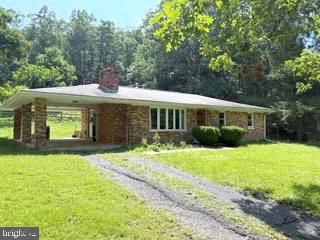 TOTAL BRICK 3 BEDROOM, 1 BATH RANCHER SITUATED ON 2.67 ACRES AND NESTLED IN THE HEART OF AMISH COUNTRY. ORIGINAL OAK HARDWOOD FLOORS THRU OUT. ALL NEWLY UPGRADED VINYL WINDOWS. BRICK FIREPLACE W/MANTLE. FULL UNFINISHED WALK-OUT BASEMENT WIT NEW HOT-WATER HEATER, WASHER & DRYER AND TUB-BASIN SINK. POTENTIAL GUEST HOME (CURRENTLY USED AS WOOD WORKING SHOP) WITH NEW METAL ROOF. ROUGH CUT BAR-BOARD CHICKEN COOP/RUN-IN SHED. (20’ X 30’) BARN WITH 2ND FLOOR “BANK BARN”. NEW LIVESTOCK FENCING INSTALLED. OTHER AMENITIES: ELECTRIC RADIANT HEAT, 25 YEAR SHINGLE ROOF, WASHER & DRYER INCLUDED, (2) GRAVEL DRIVEWAYS, GENERATOR, PUBLIC WATER, SKYLIGHTS, WOOD BURNING STOVE AND MUCH MORE PLUS ITS “UNRESTRICTED”! NOW YOU CAN FINALLY START THAT MINI-FARM OR HOBBY SHOP YOU AWWAYS DREAMED OF!